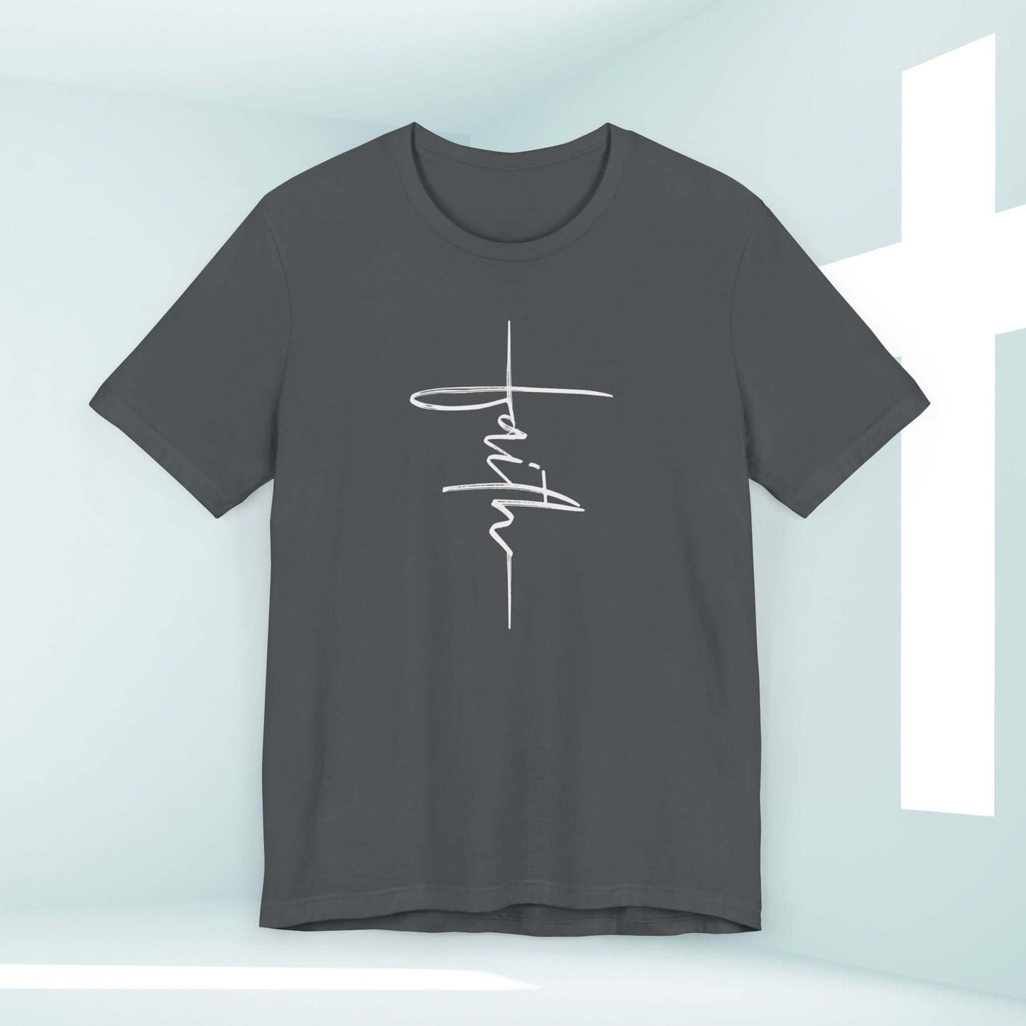 Women's dark gray Christian faith shirt with white script reading "faith" against a minimalist background featuring a cross-shaped window.