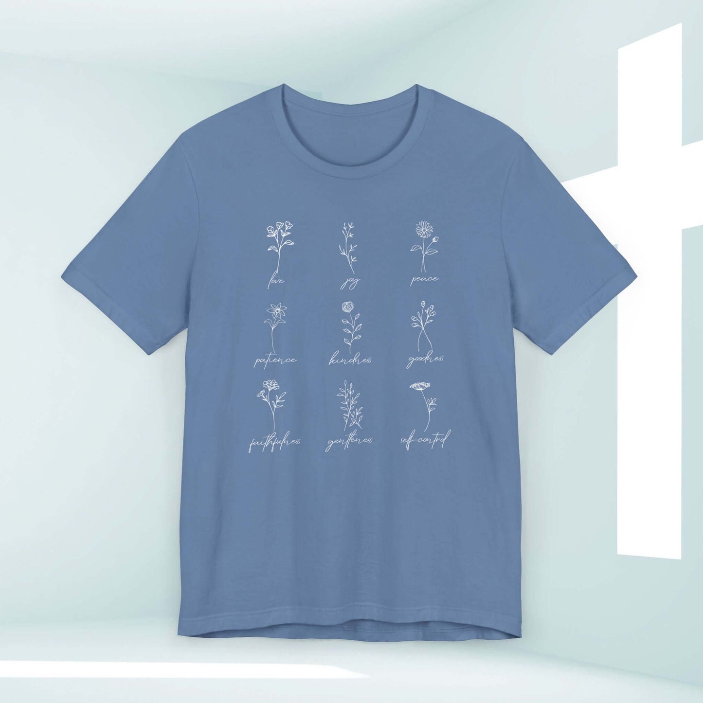 Blue Christian t-shirt with delicate floral designs representing the Fruits of the Spirit, faith-based inspirational bible verse shirt.