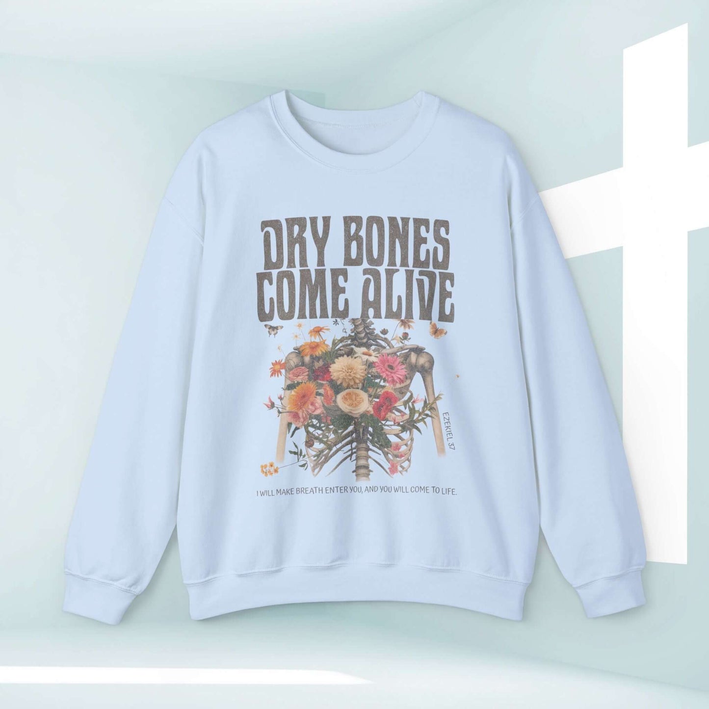 Christian Halloween sweatshirt with "Dry Bones Come Alive" design featuring skeleton and flowers, faith-themed apparel.