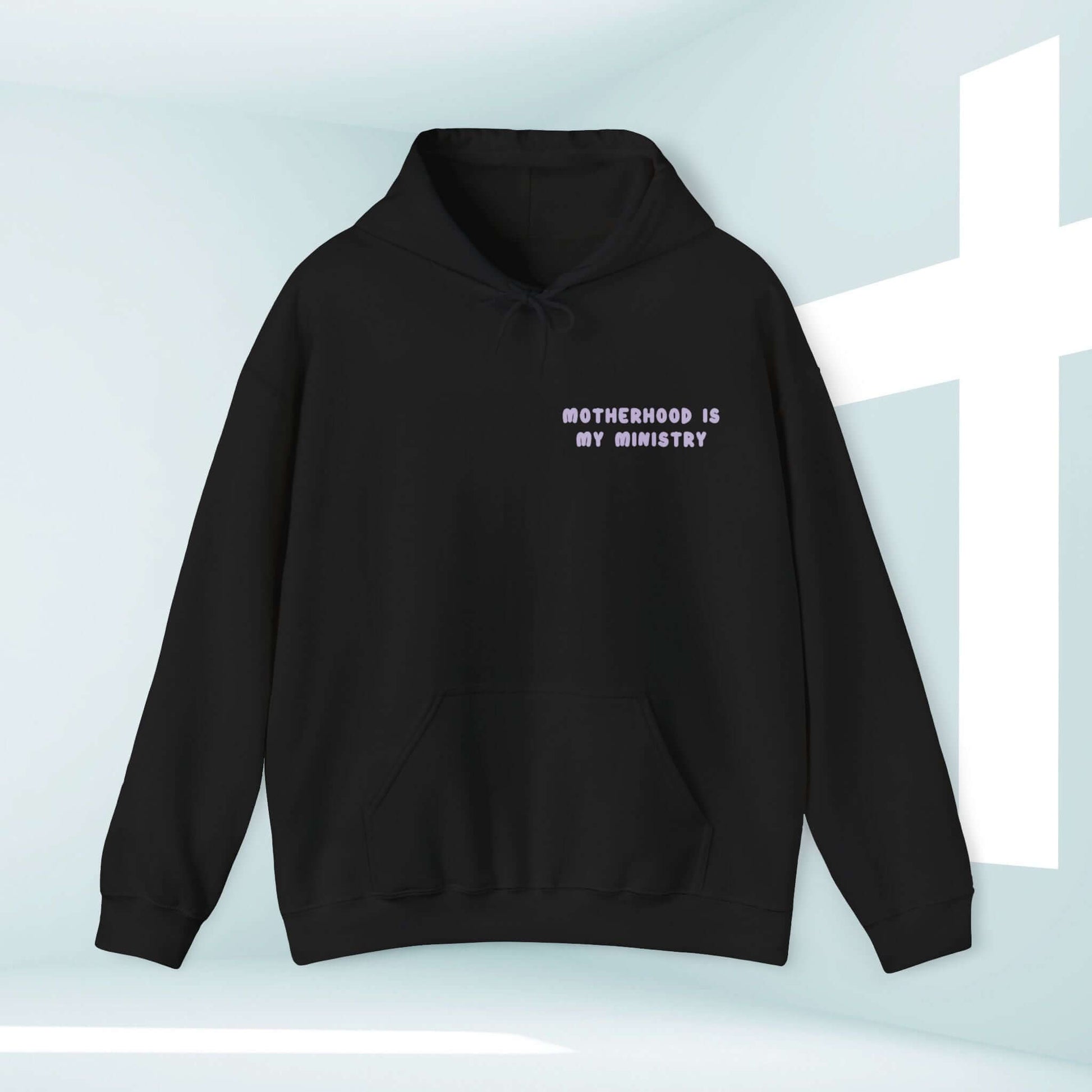 Motherhood Is My Ministry Christian hoodie in black, inspirational hoodie for homeschoolers, gifts for new moms, and Christian clothing.