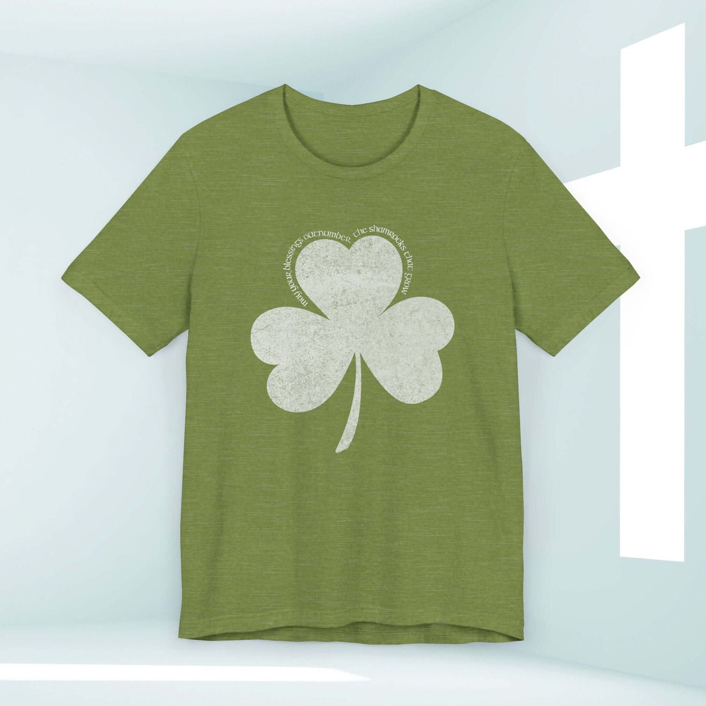 Green St Patrick's Day shirt with shamrock clover design and Christian blessings displayed on a light background.