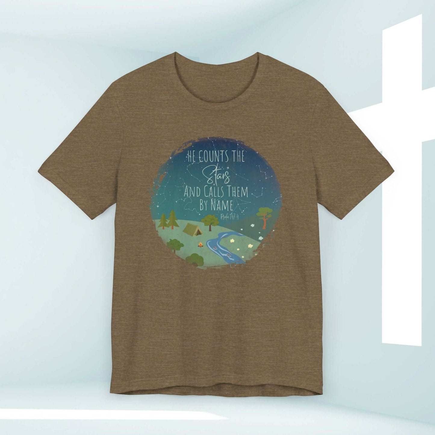 Women's Christian t-shirt with "He Counts The Stars And Calls Them By Name" bible verse, nature-themed inspirational design.