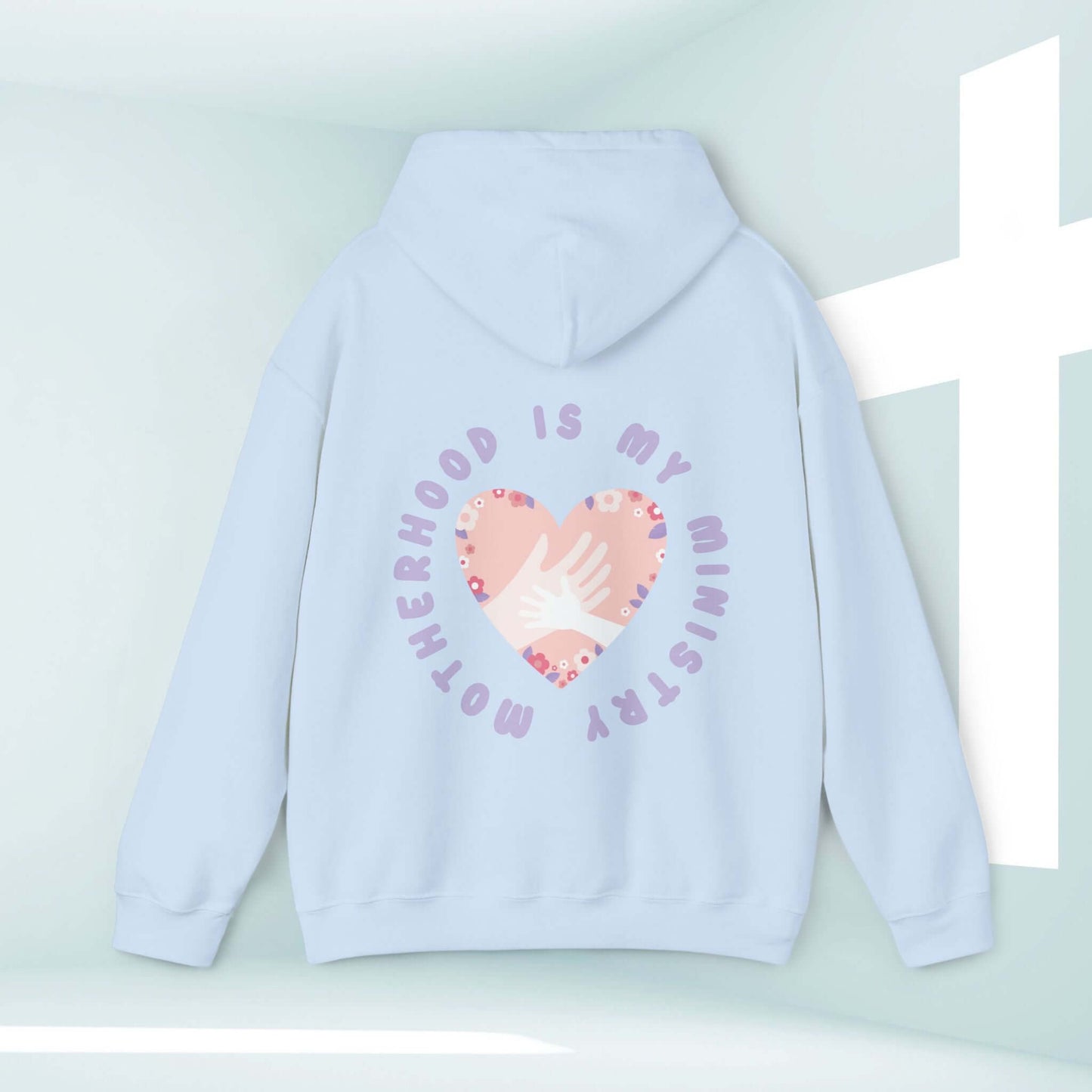 Light blue "Motherhood Is My Ministry" Christian hoodie with heart design, perfect gift for moms, homeschoolers, and new mothers, inspirational faith-based clothing.