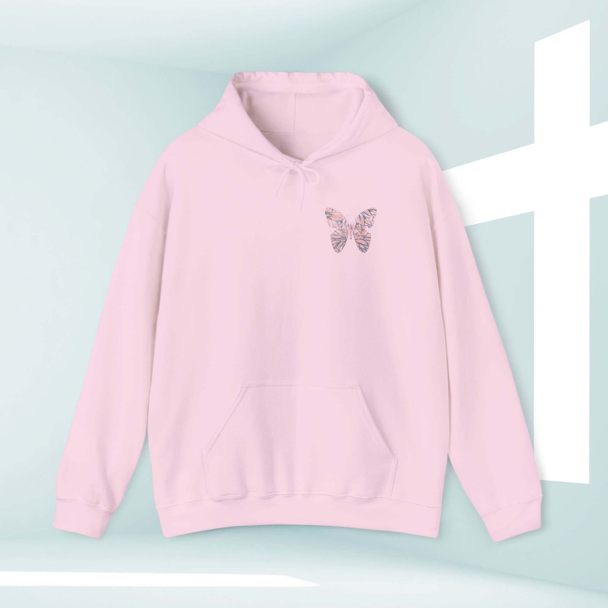 "Butterfly Christian Hoodie, In Christ Is A New Creation hooded sweatshirt in soft pink with inspiring Bible verse design."