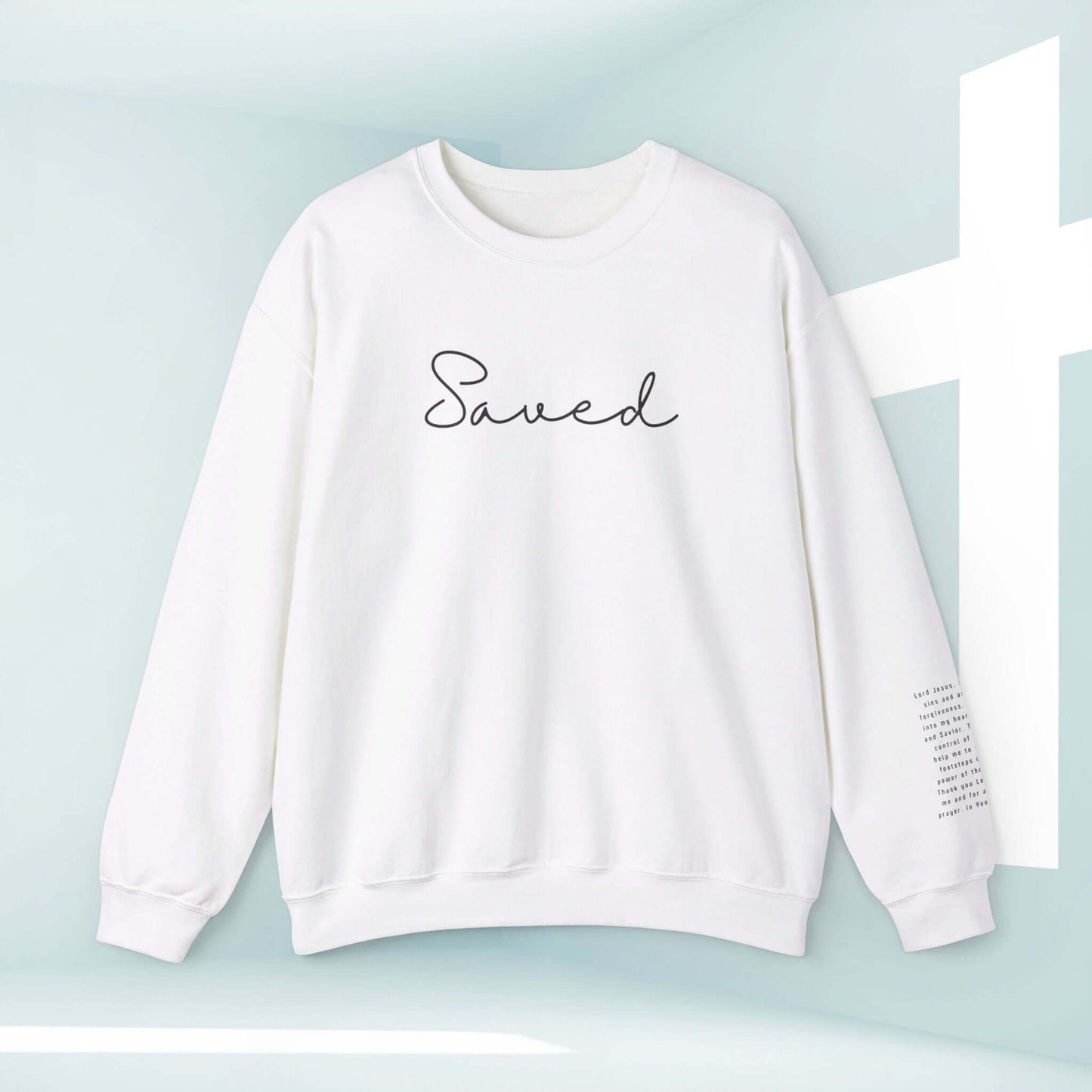 White Christian sweatshirt with "Saved" text on front and Sinners Prayer on sleeve, religious apparel perfect for inspiration and faith expression.