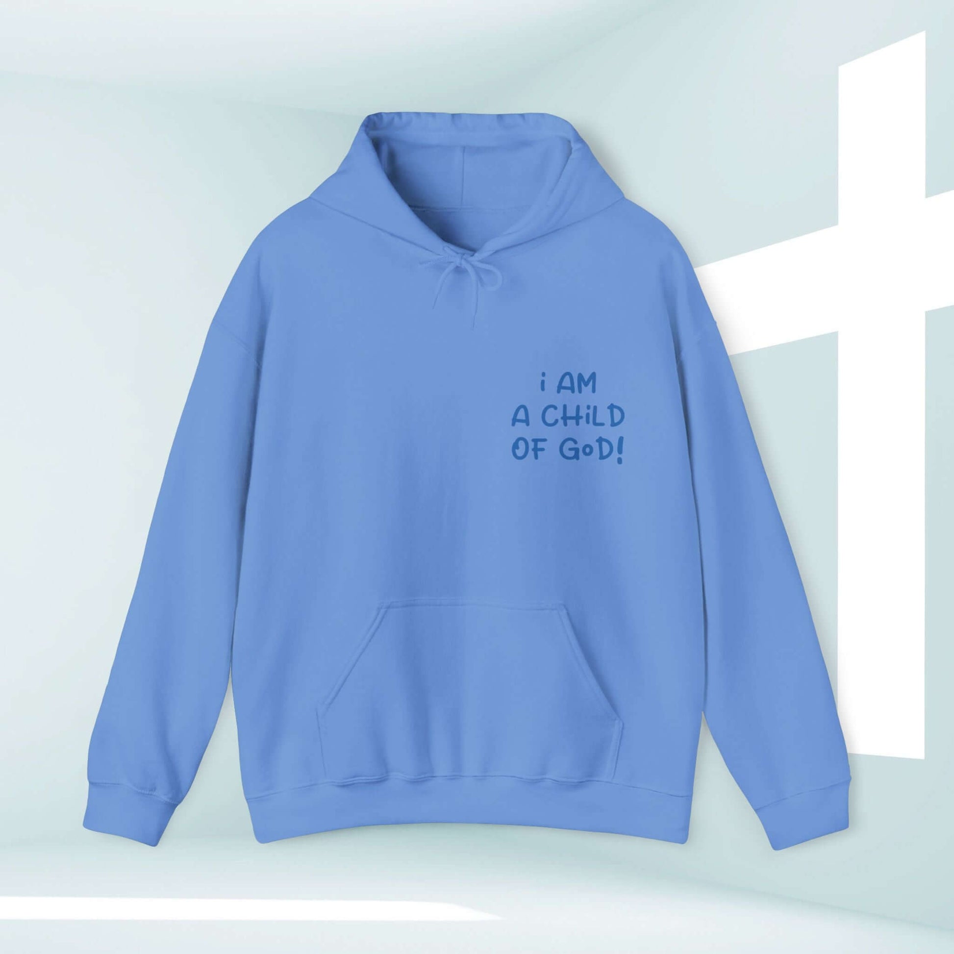 Light blue "I Am A Child Of God" Christian hoodie with a kangaroo pocket and double-lined hood on display near a white cross background.