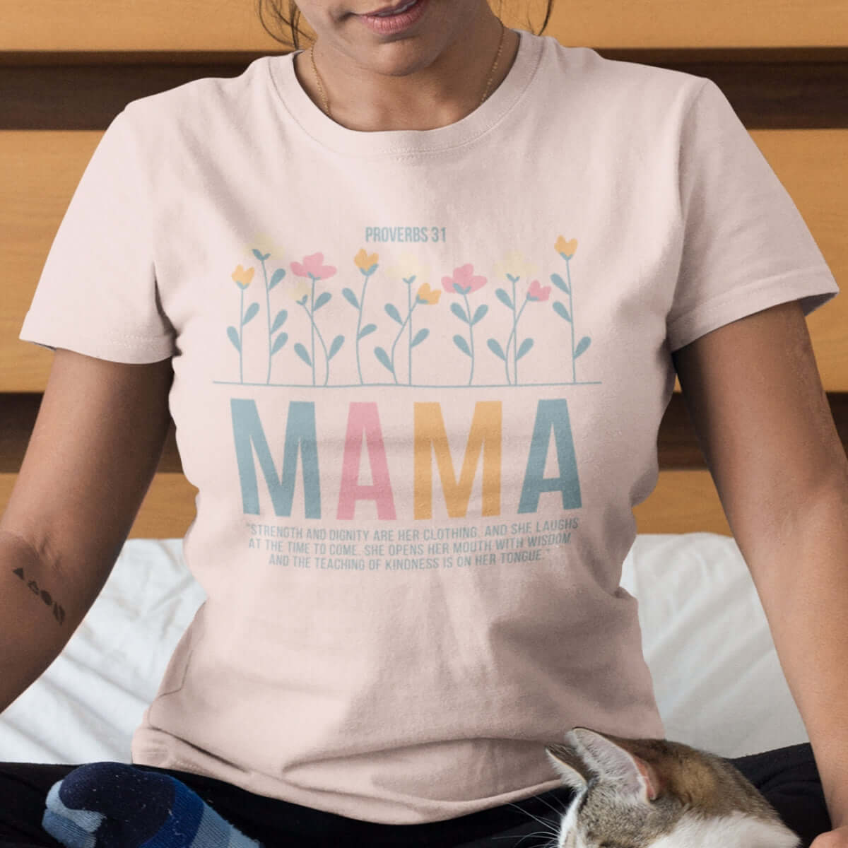 Mother wearing a floral Christian Proverbs 31 "Mama" t-shirt, perfect Mother's Day gift, faith-based graphic shirt with Bible verse.