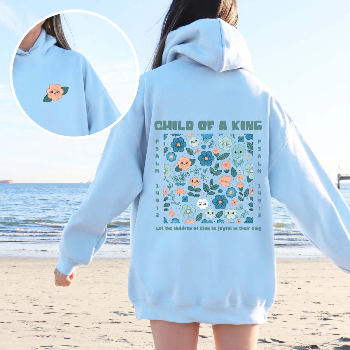 Child Of A King Bible Verse Christian Hoodie worn at the beach, inspirational faith-based sweatshirt with floral design, perfect Christian apparel gift