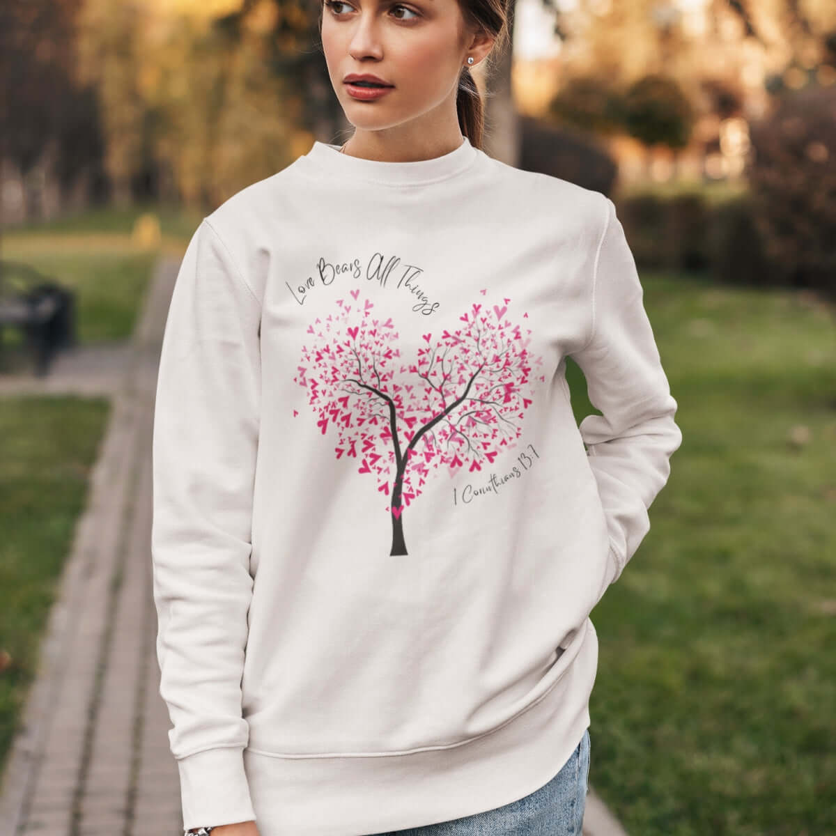 Woman wearing Christian Love Bears All Things Tree Heart Wedding Sweatshirt, perfect valentine's day gift.