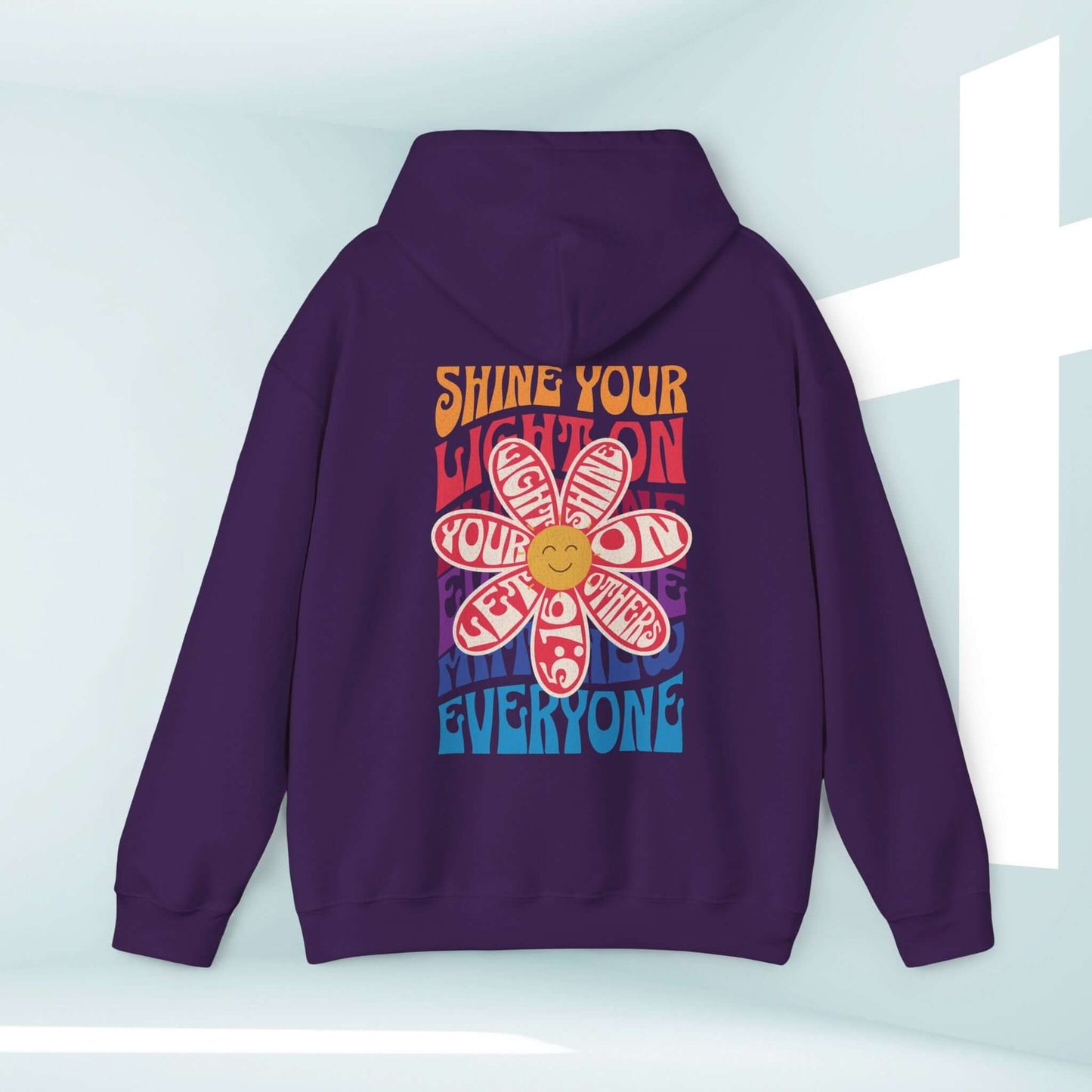 Christian boho hoodie with colorful flower design and "Shine Your Light on Everyone" message, perfect faith-based pullover sweatshirt.