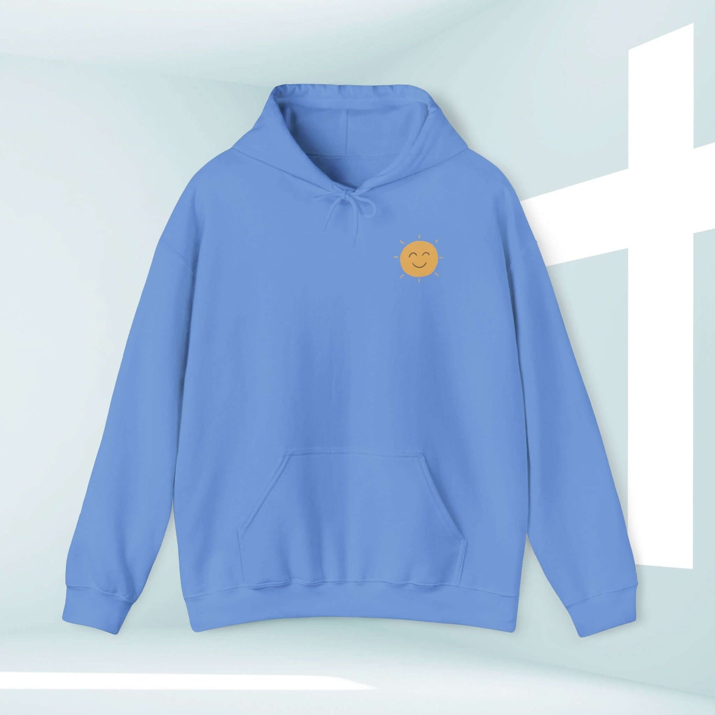 Shine Your Light Christian boho hoodie with smiley face and cross background for faith-based inspiration and connection.