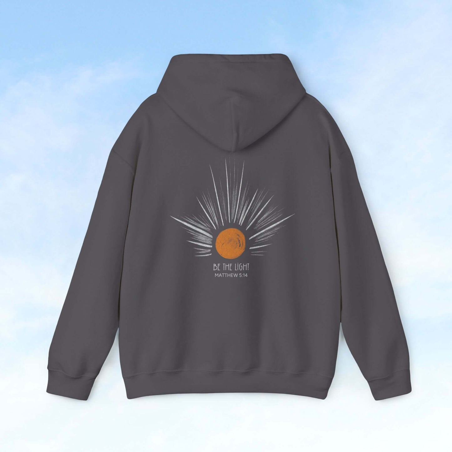 Be The Light Sunburst Christian hoodie with celestial sun ray graphic and Bible verse, perfect faith-based gift and Christian apparel.