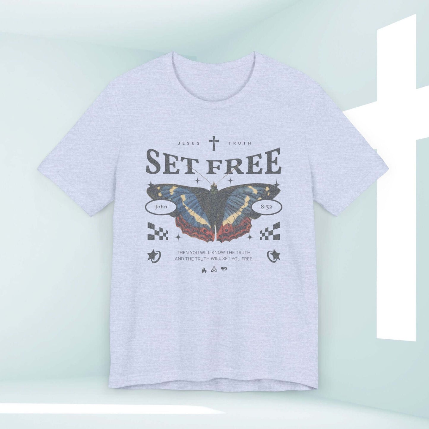 Butterfly Set Free Christian T-shirt with Bible verse design on a light grey shirt, Christian apparel, religious shirts, and Christian streetwear