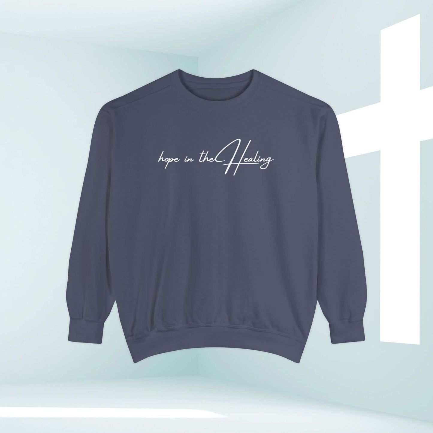 "Hope In The Healing Christian crewneck sweatshirt for cancer survivors and get well soon gift in front of a white cross background"