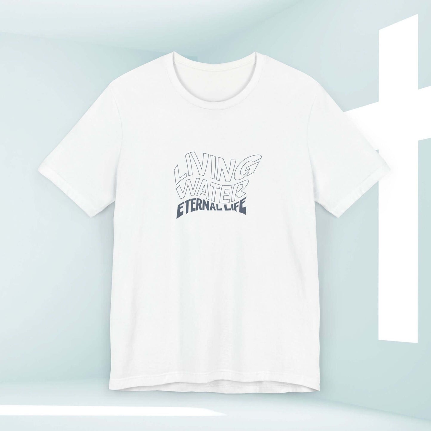 White Living Water Eternal Life t-shirt with faith-based graphic displayed in a minimalistic room with a cross in the background.