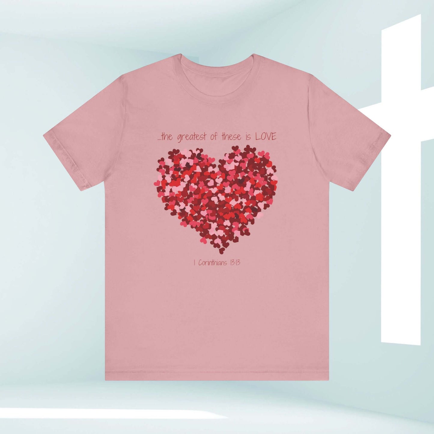 Pink Christian Valentine's Day t-shirt with heart graphic and "the greatest of these is love" text, perfect wedding tee and valentines day gift