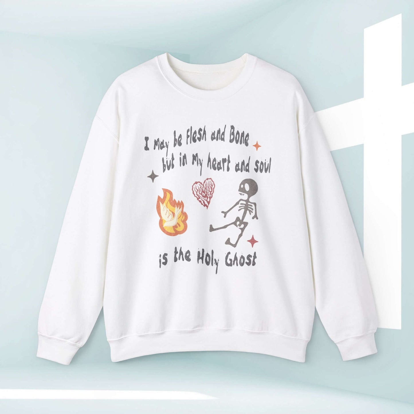 Christian Halloween sweatshirt with "I May Be Flesh And Bone But In My Heart Is The Holy Ghost" design, featuring dancing skeleton.