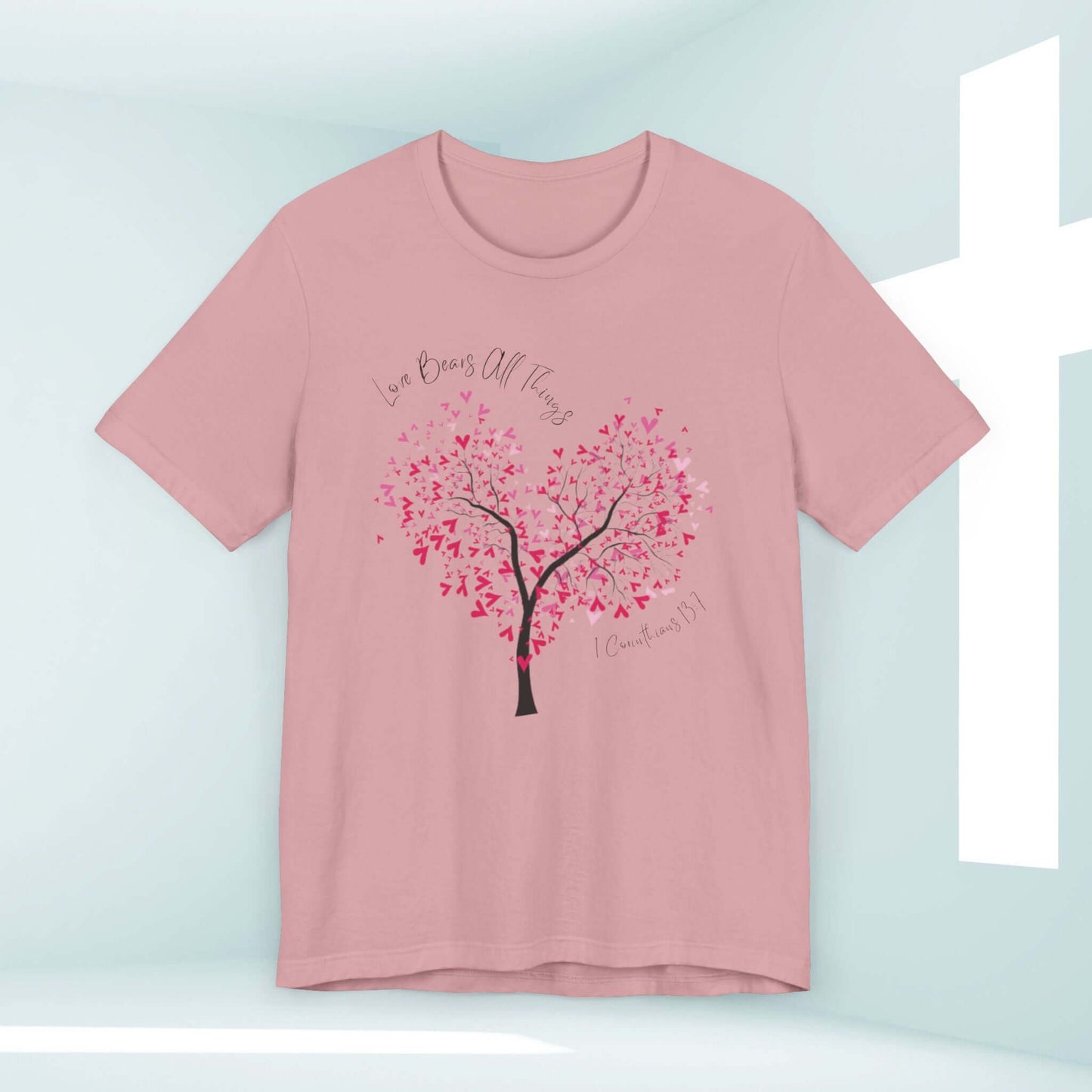 Christian Love Bears All Things t-shirt in pink with heart tree design, perfect for weddings, Valentine's Day, and faith-based occasions