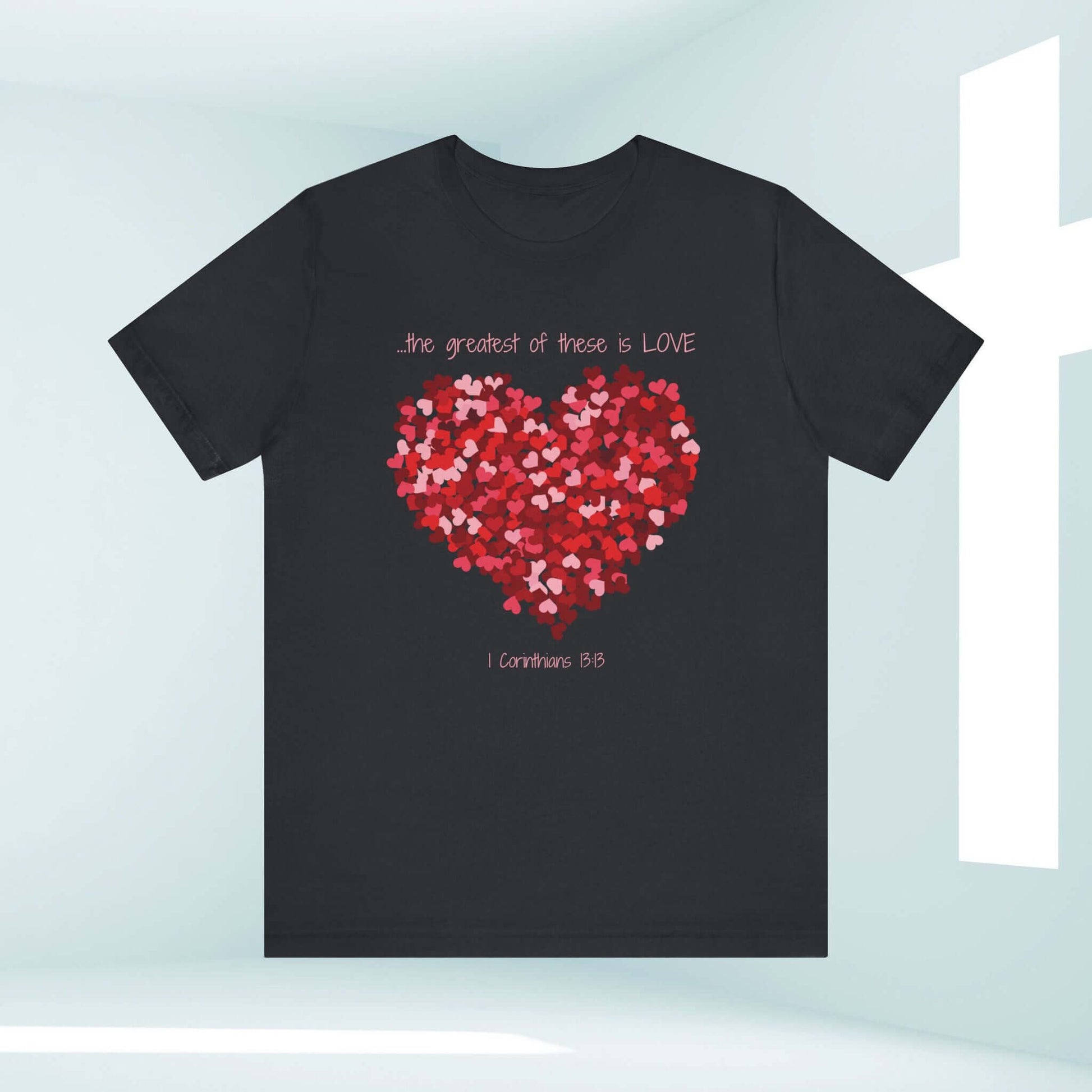 Christian Valentine's Day t-shirt with a red heart design and "The greatest of these is LOVE" text, perfect wedding or anniversary gift.