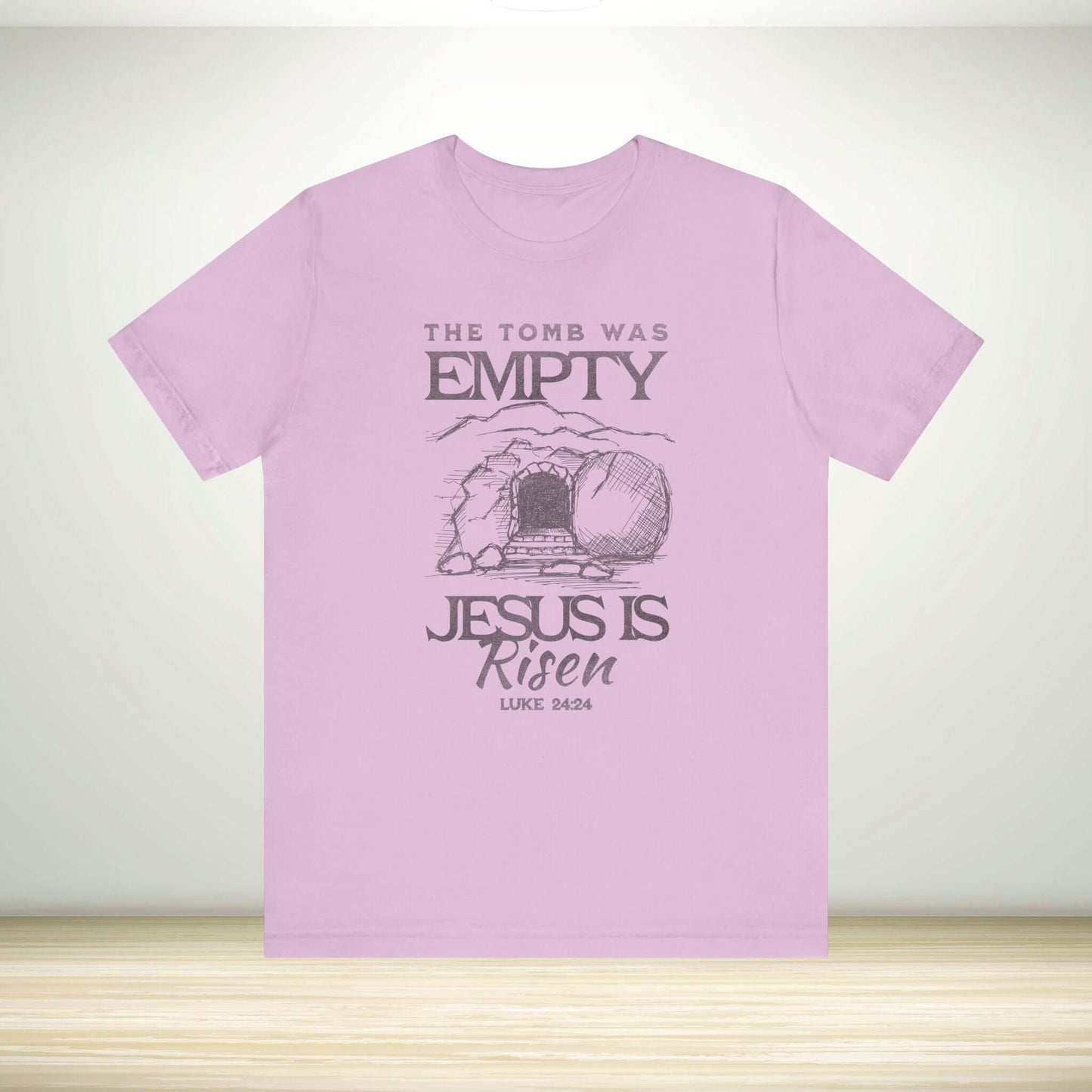 Christian Easter shirt with "The Tomb Was Empty Jesus Is Risen" message, religious t-shirt featuring Luke 24:24 Bible verse.