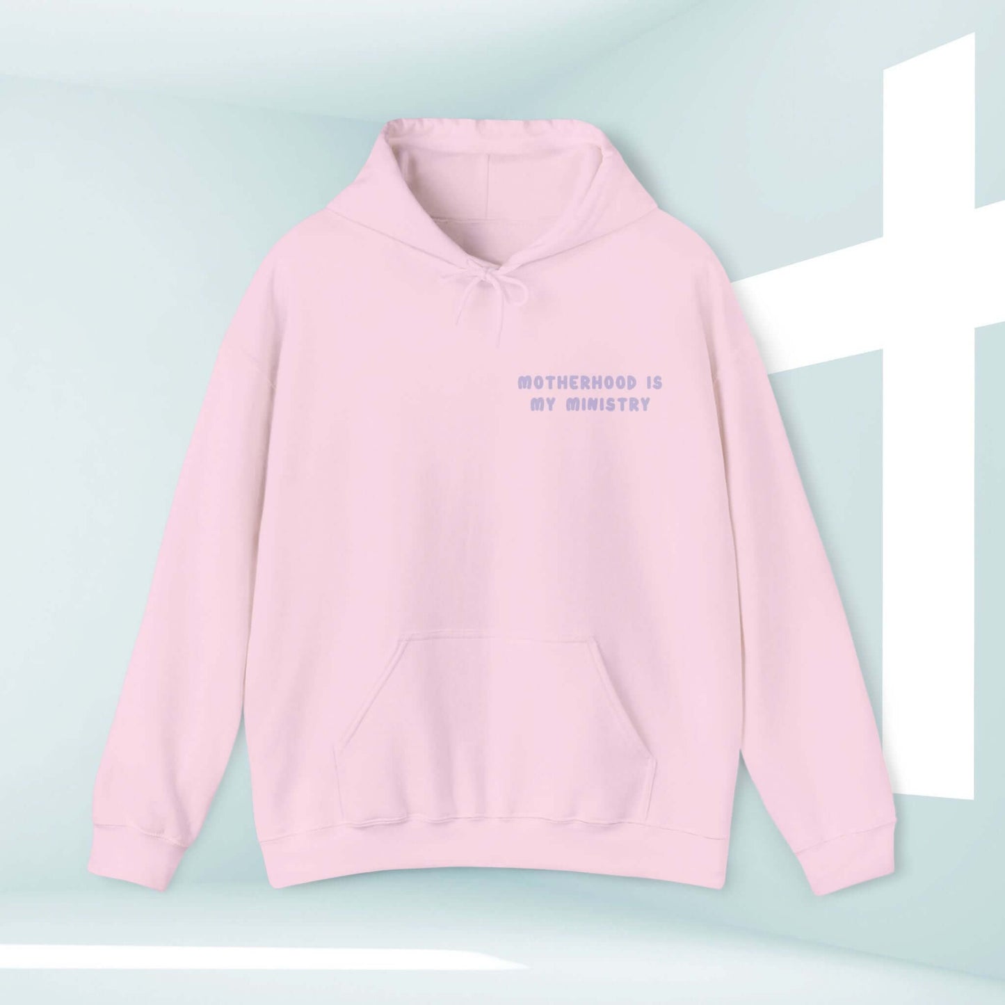 Pink "Motherhood Is My Ministry" Christian hoodie for homeschool moms, an inspirational gift for her with a Bible verse design.