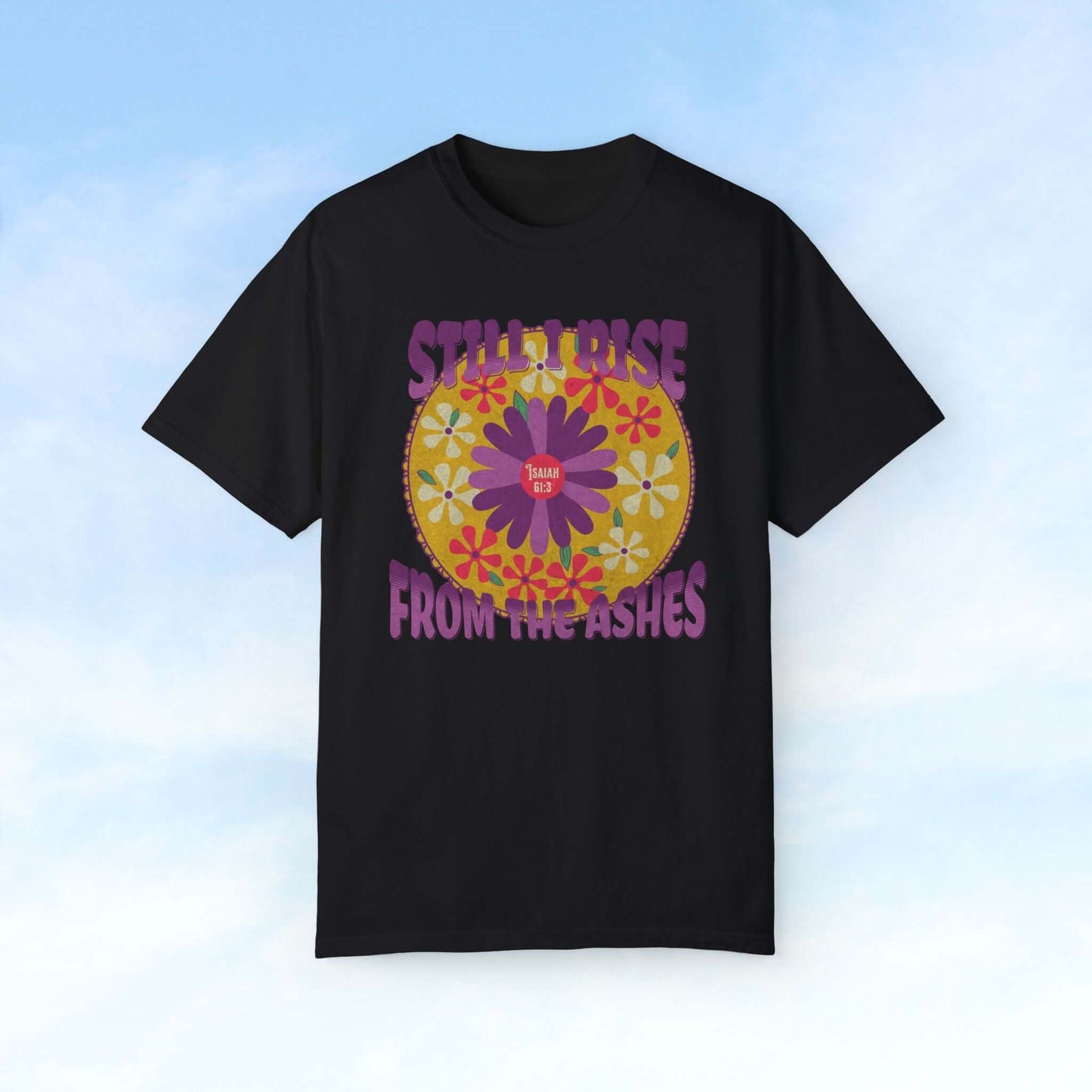 Black Christian floral shirt with "Still I Rise From The Ashes" text and colorful flower graphic. Faith-based inspirational Christian tee.