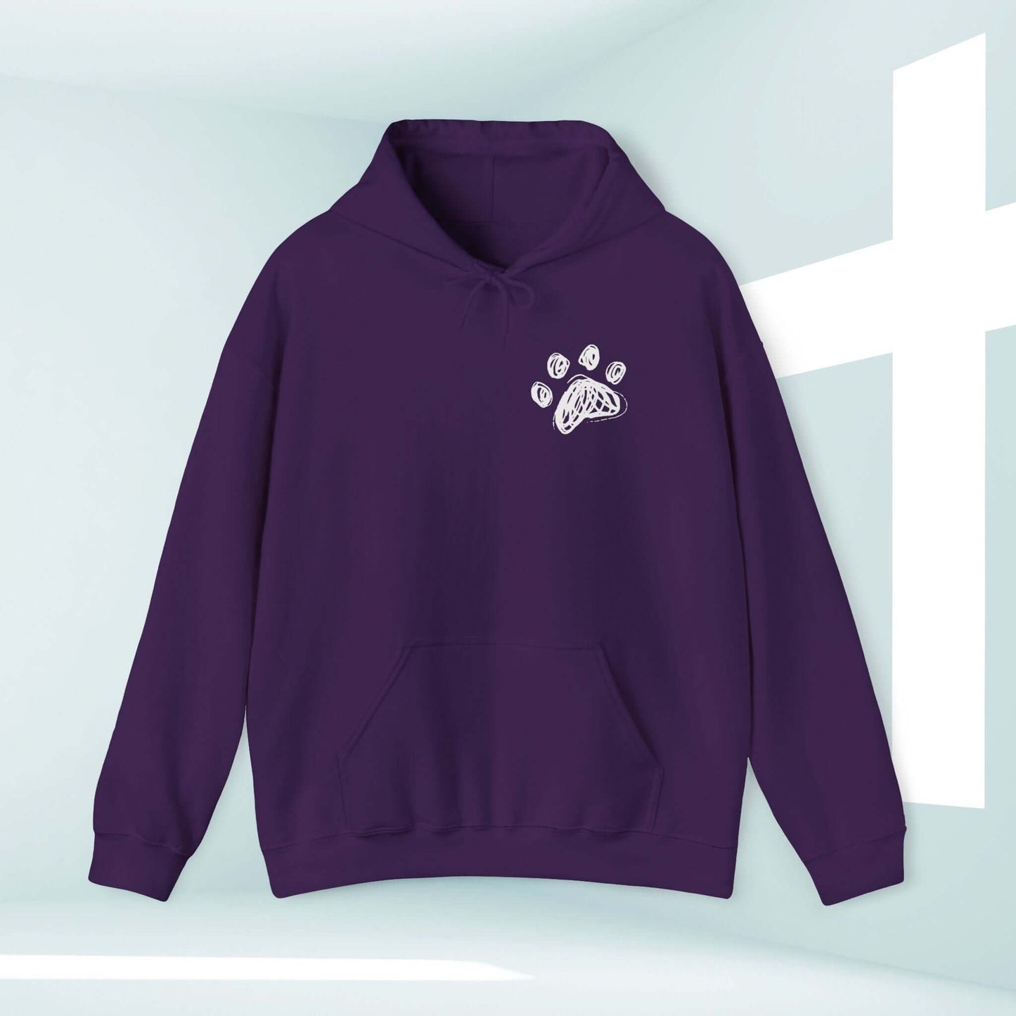 Purple Dog Mom Christian hoodie with paw print design, featuring "I Pray With My Dog" message, perfect dog lover sweatshirt in front of a white cross.