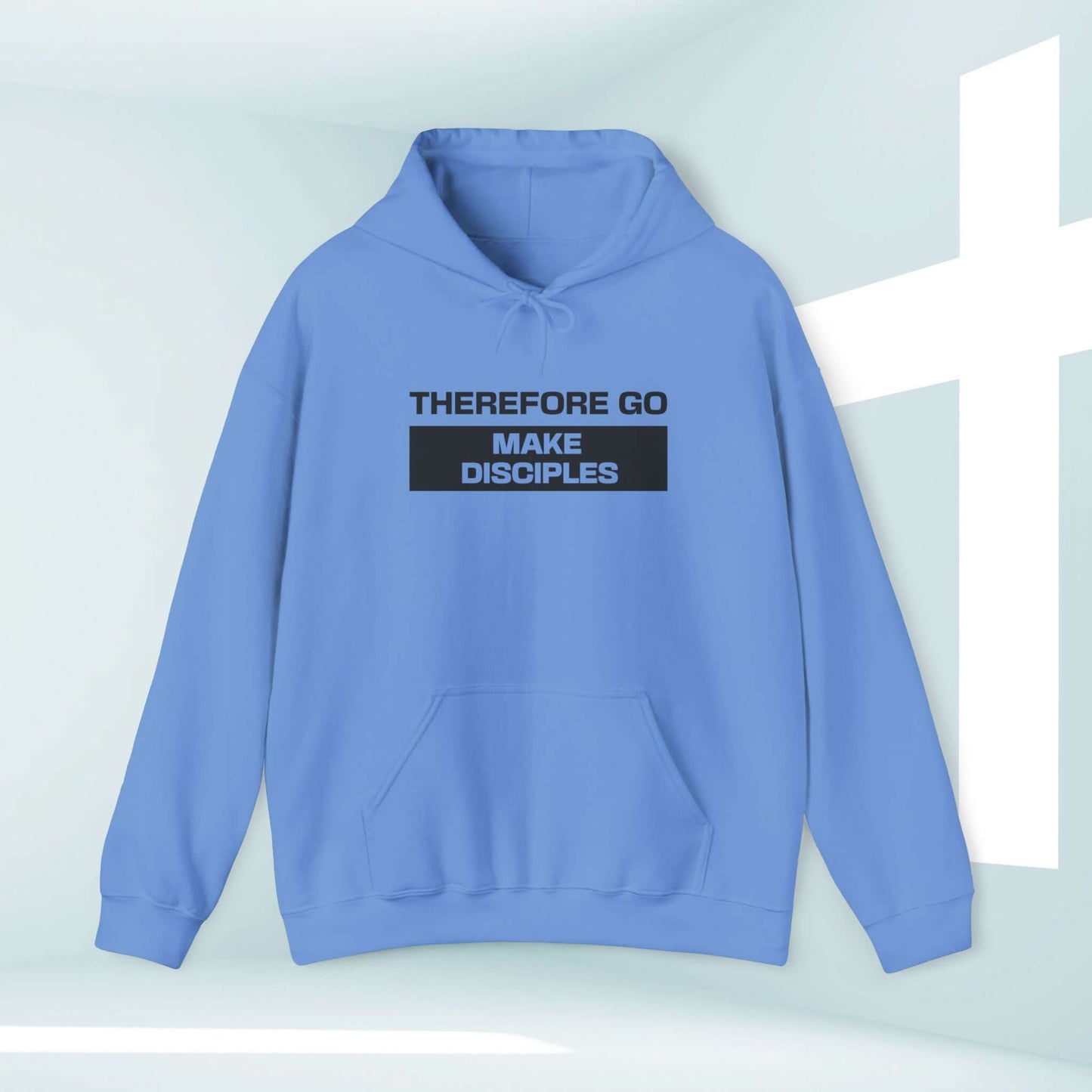 Light blue "Therefore Go And Make Disciples" Christian hoodie with Bible verse against a pastel background and cross.