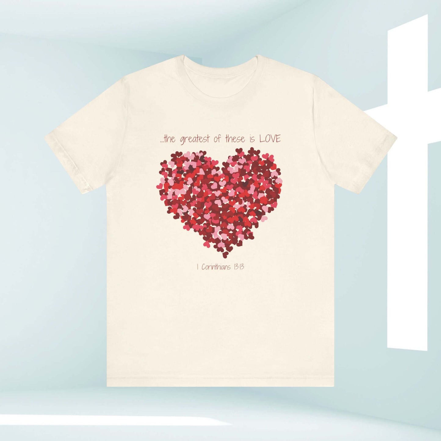 Christian Valentine's Day t-shirt with heart design and "The greatest of these is LOVE" text, perfect for wedding or anniversary gifts.