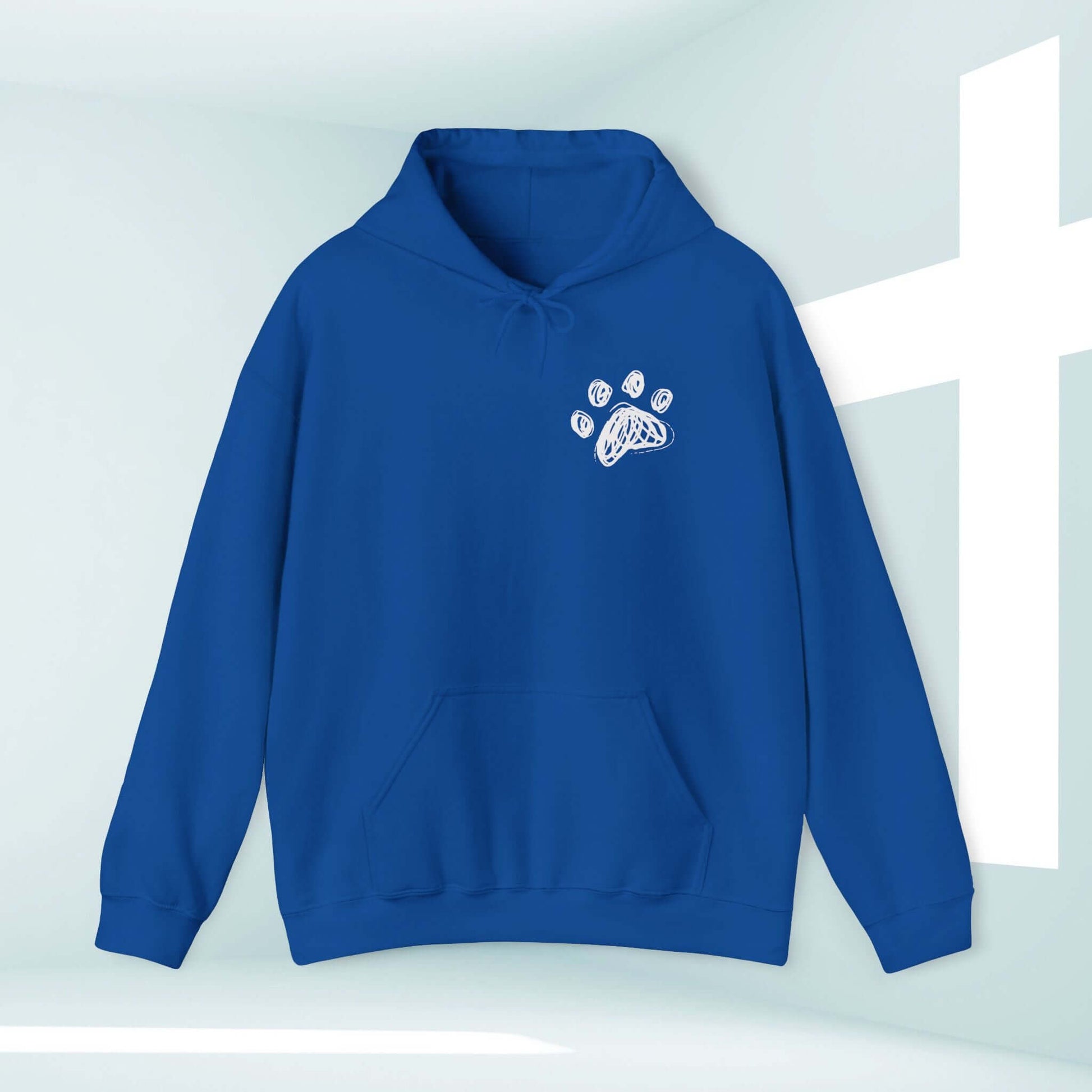 Blue Christian hoodie with paw print, I Pray With My Dog design, dog mom shirt, stylish dog lover sweatshirt against cross background