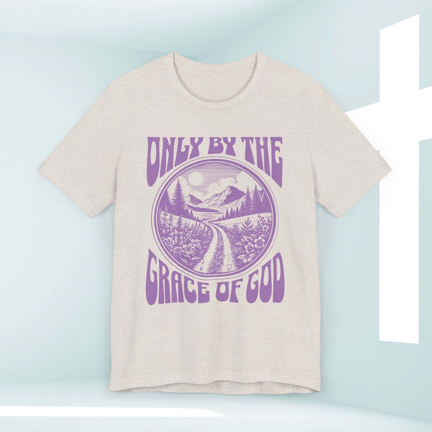 Only By The Grace Of God Christian T-Shirt with Scenic Graphic and Inspirational Message displayed in a Church Setting