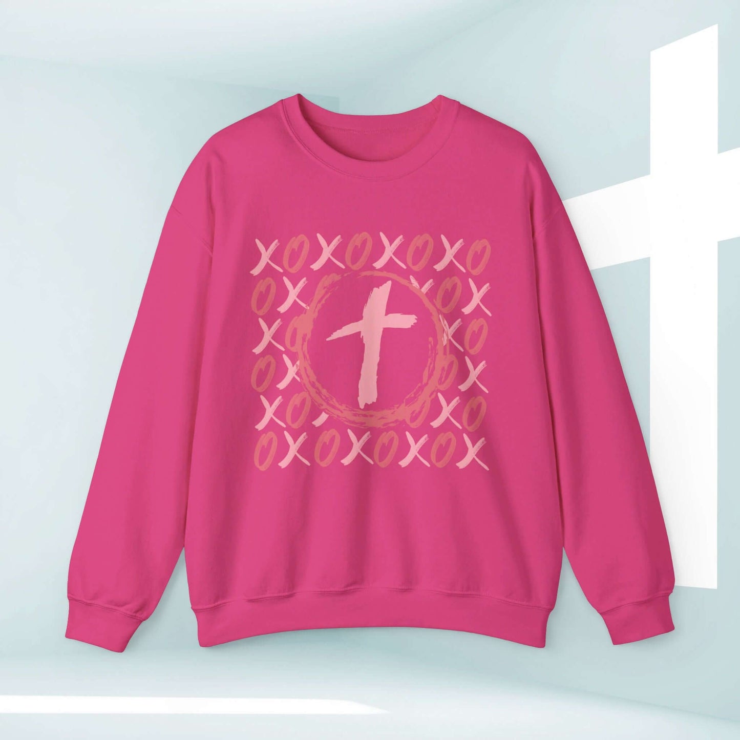 Christian wedding love sweatshirt in pink with XOXO heart cross design, perfect Valentine's Day or anniversary gift, unisex and ethically made.