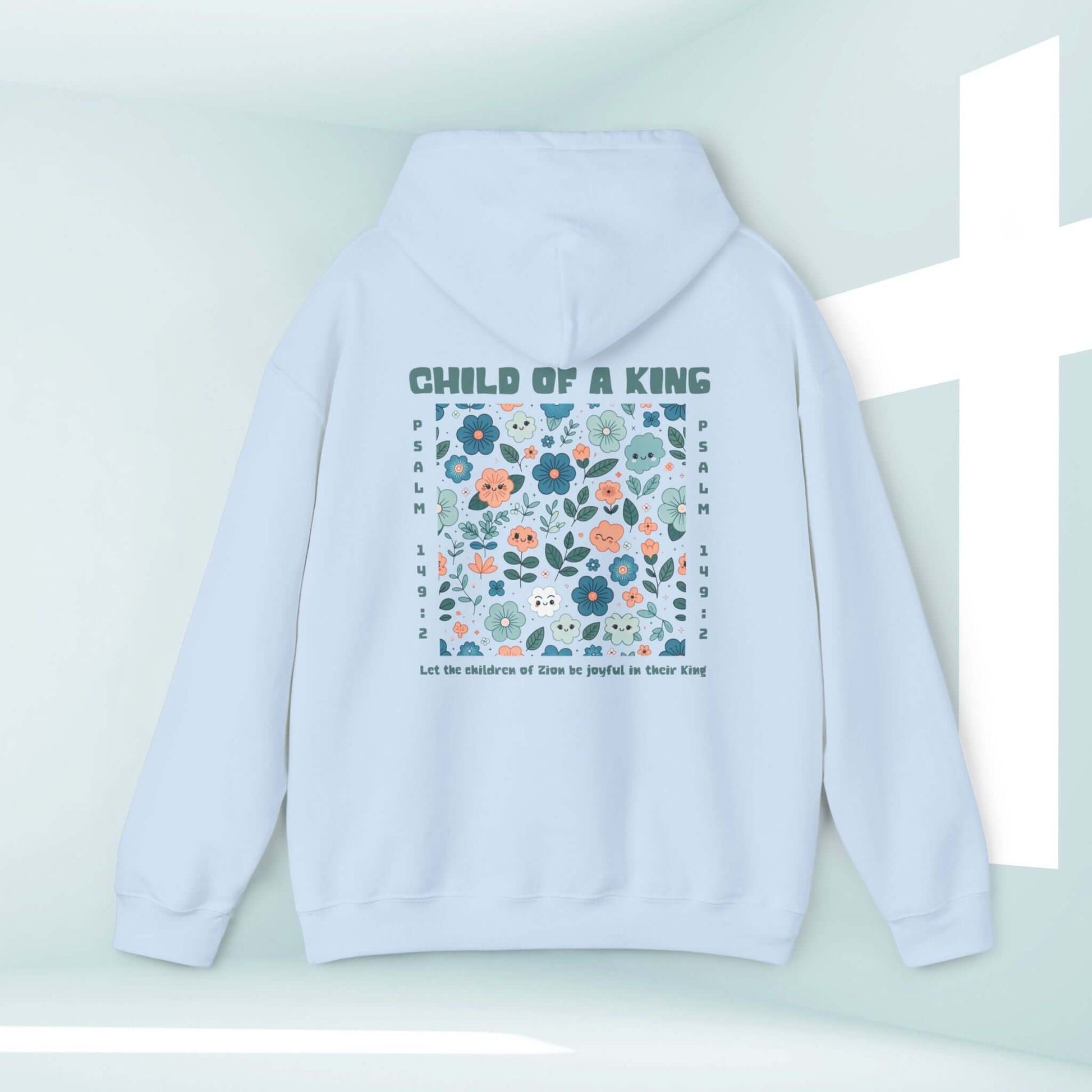 Light blue Child Of A King Christian hoodie with floral Bible verse design, perfect for cozy and inspirational beach days or faith-filled moments.