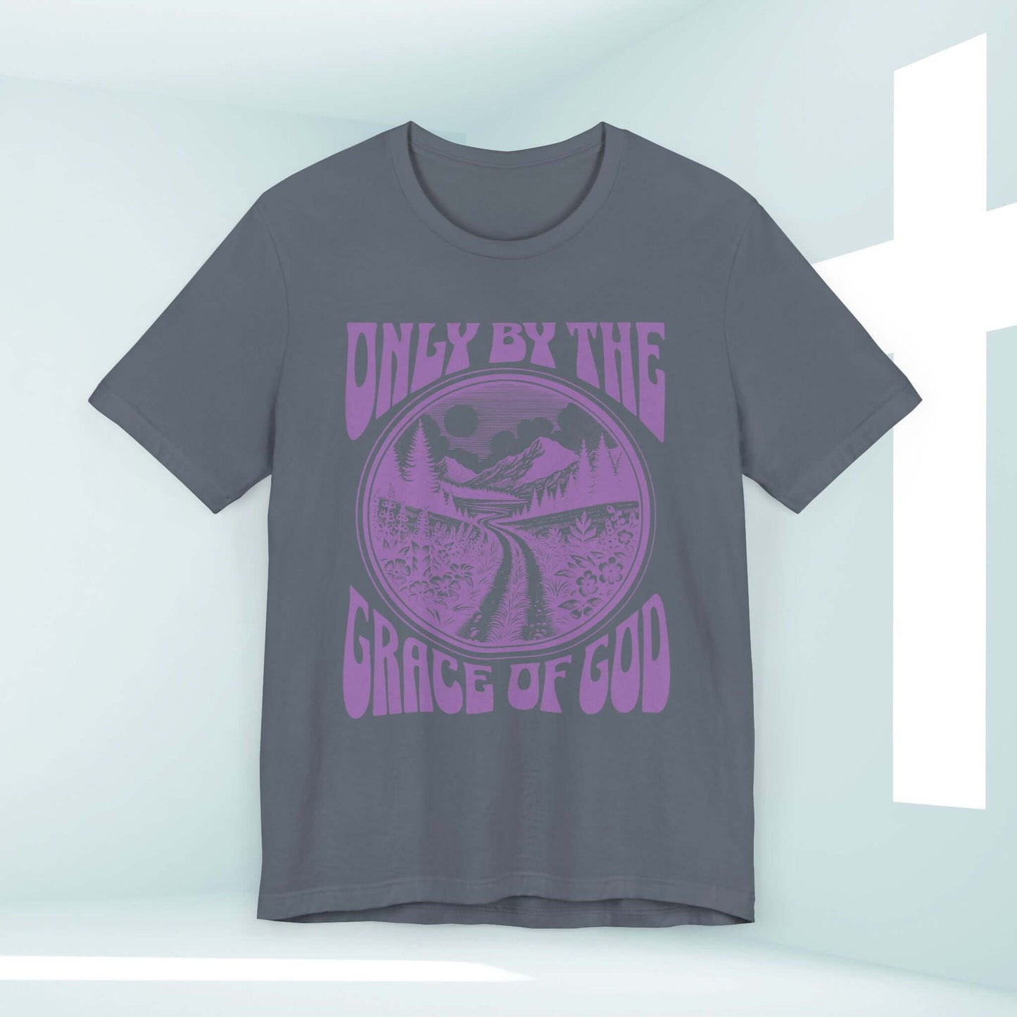 Christian shirt with "Only By The Grace Of God" text, features a scenic design, inspirational religious t-shirt perfect for sharing faith.