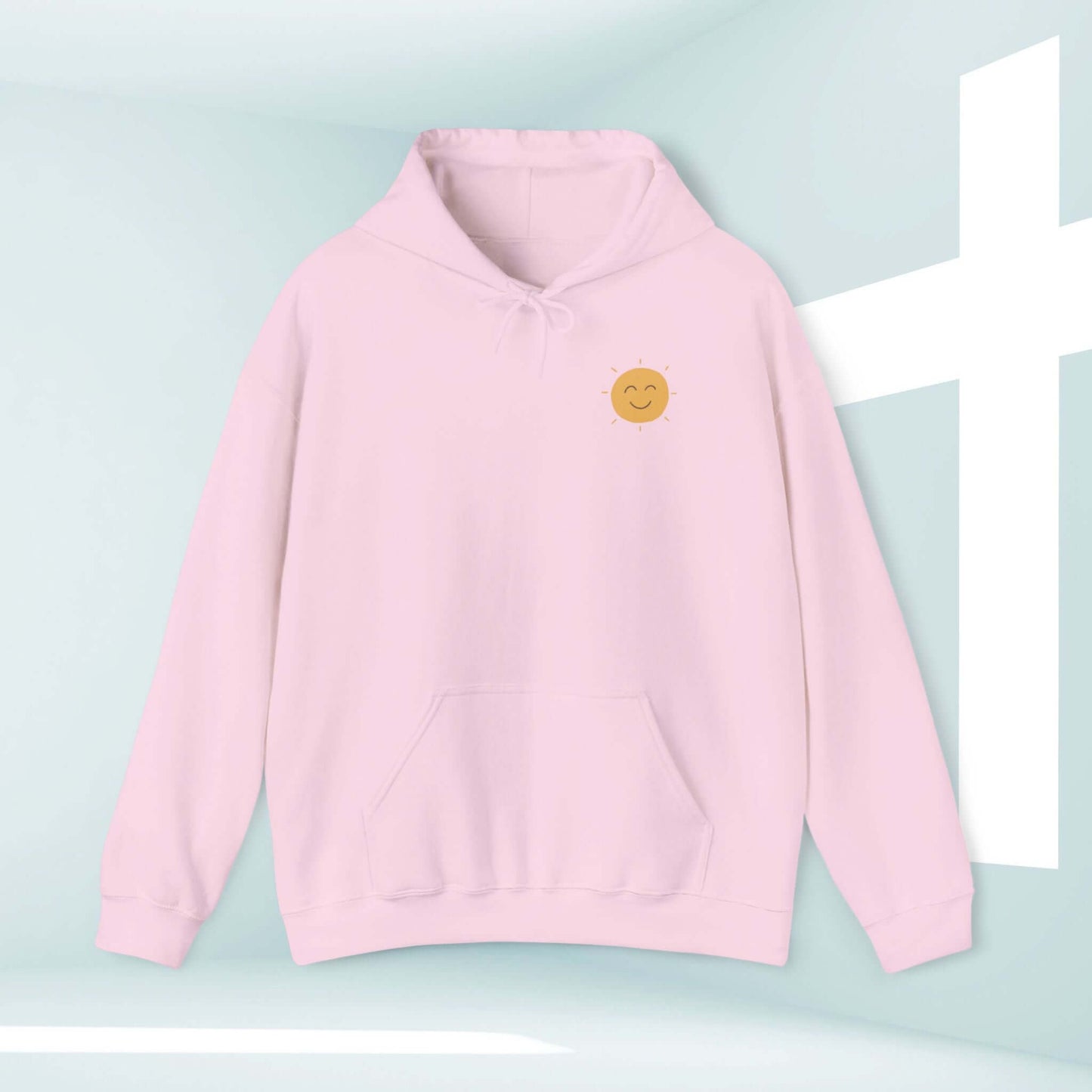 Shine Your Light Christian hoodie in pink with a smiley face design, boho-inspired hooded sweatshirt for faith-based fashion.