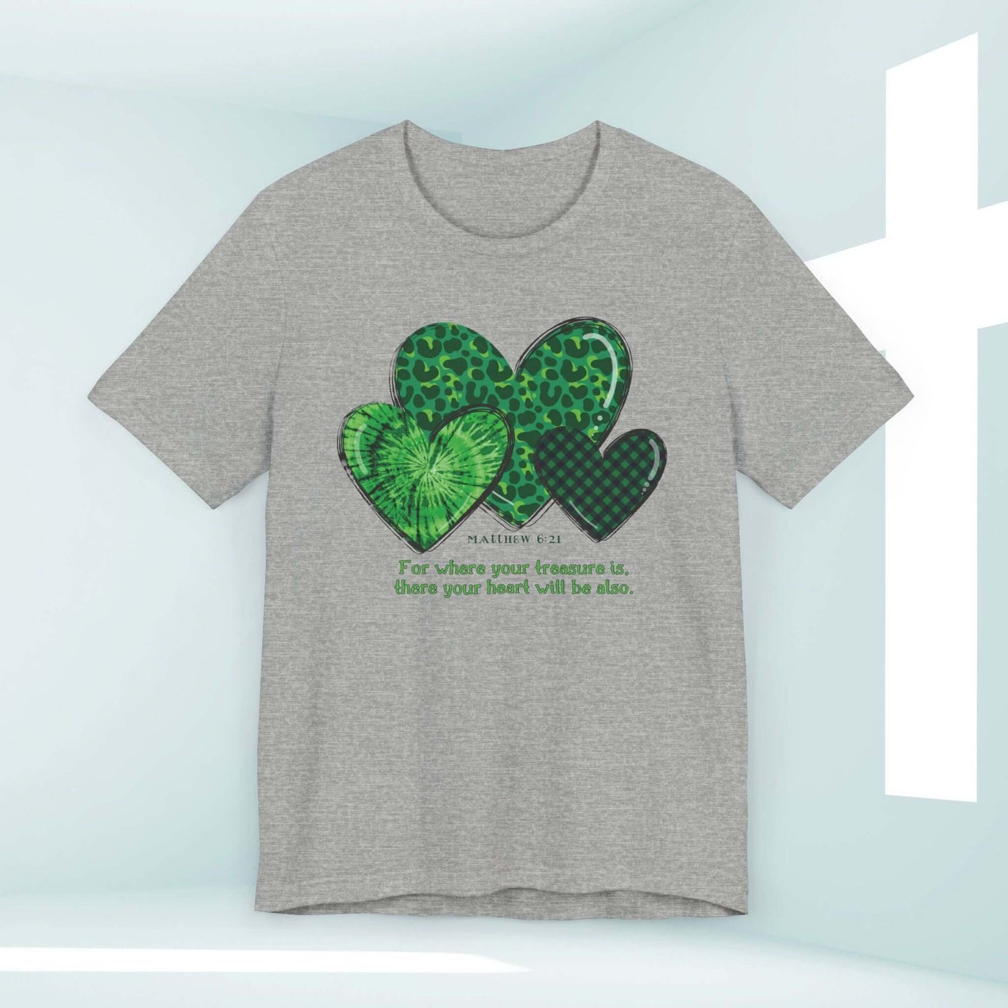 Grey St Patrick's Day shirt with green heart clovers and Bible verse, perfect for a Christian faith-based celebration.