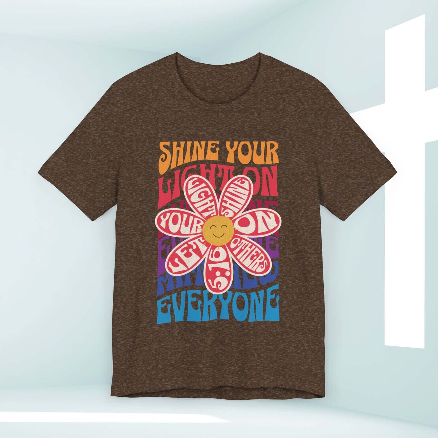 Shine Your Light Christian shirt with retro flower design, Jesus-inspired message, and vibrant colors, perfect for faith-based inspiration.