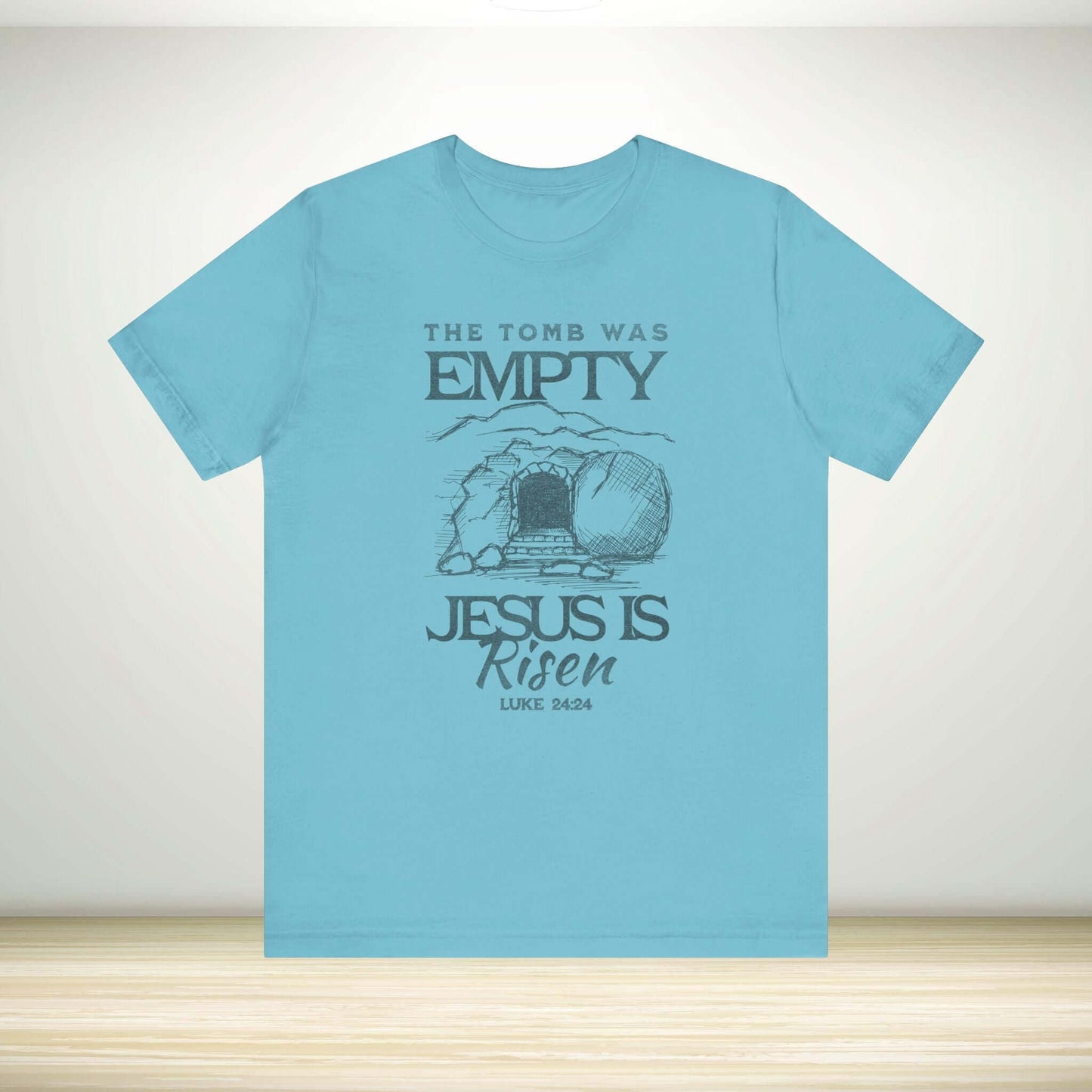 Christian Easter shirt with 'The Tomb Was Empty Jesus Is Risen' graphic, perfect religious Easter clothing gift.