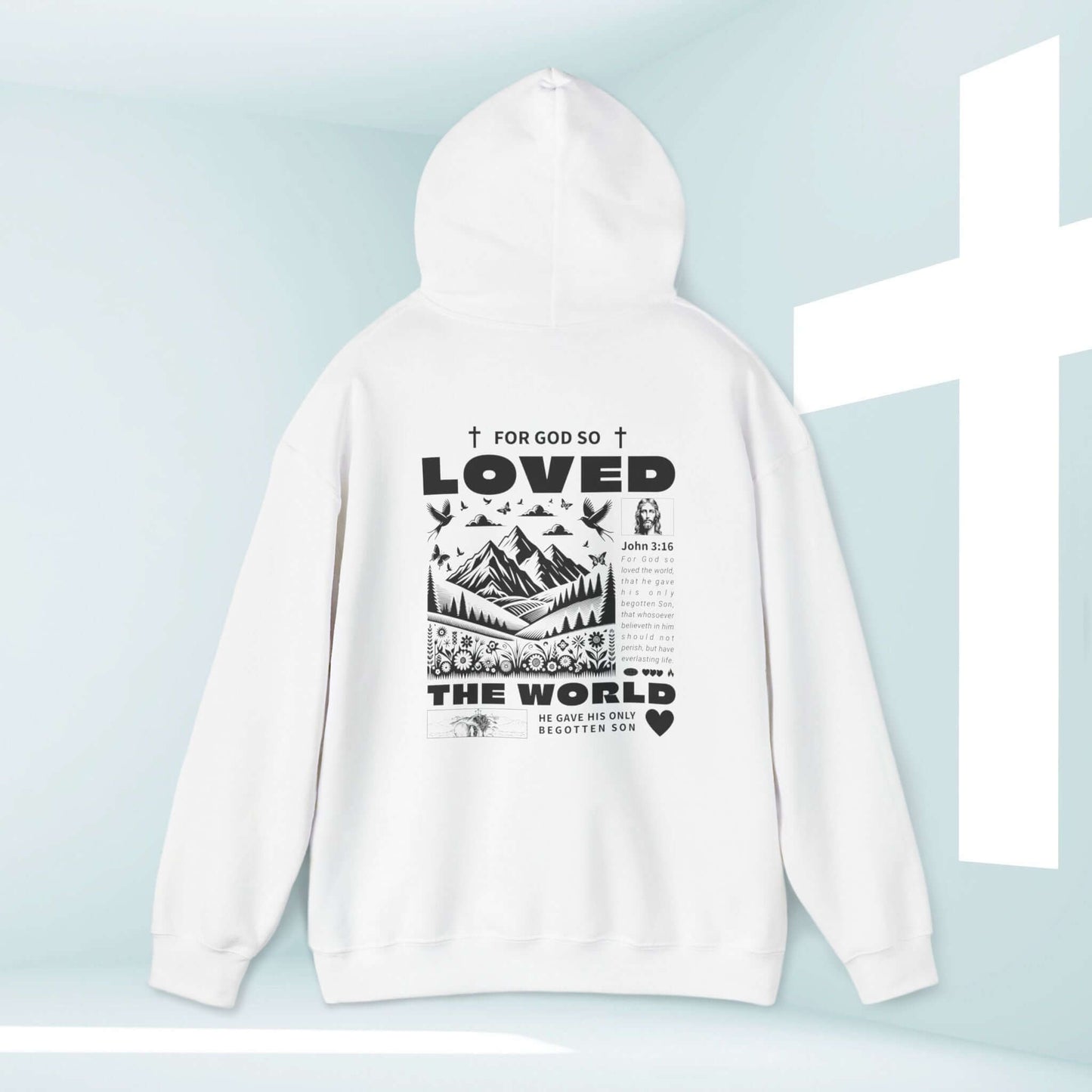 Trendy white Christian hoodie featuring John 3:16 "For God So Loved The World" design with cross and mountains, faith-inspired apparel.