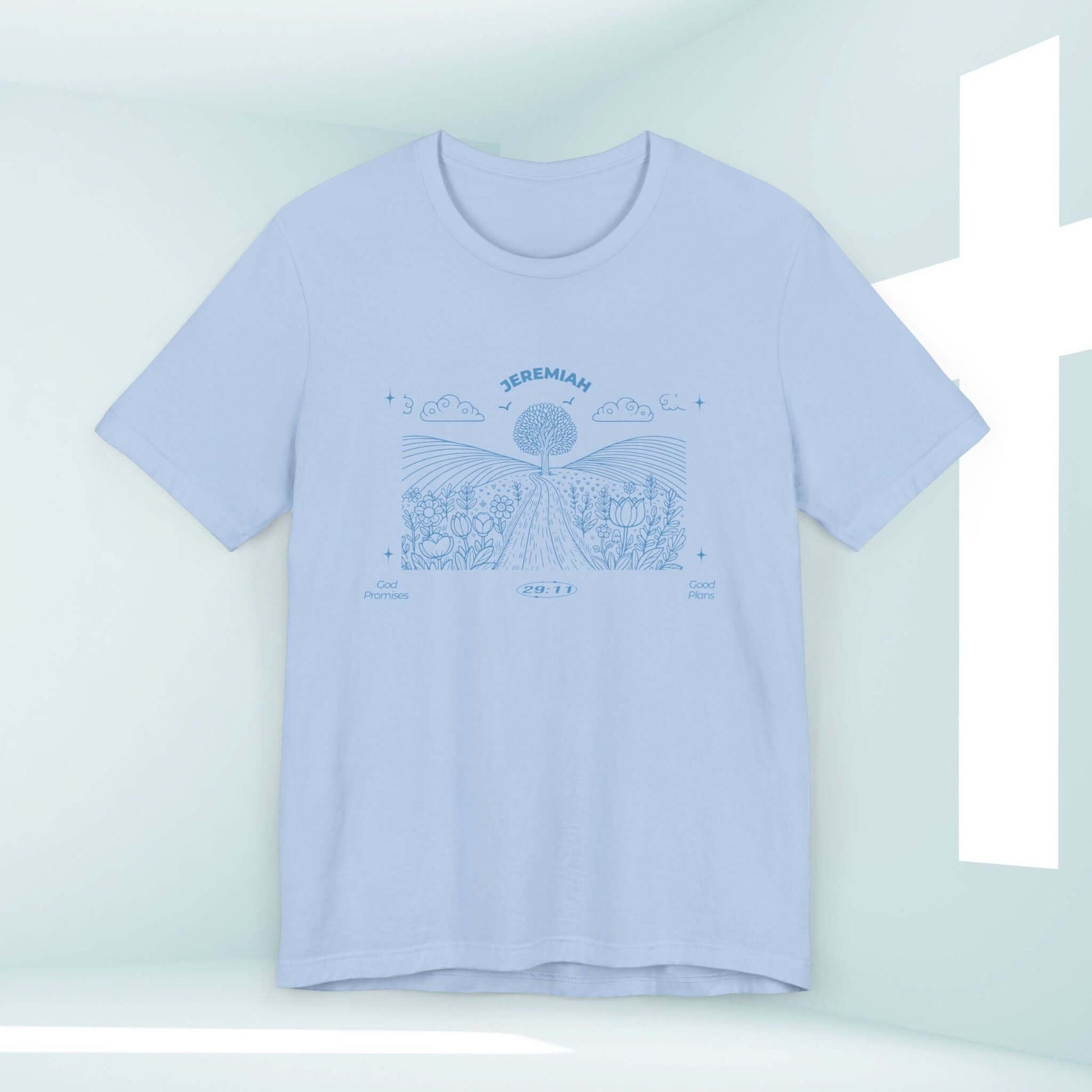 Light blue Christian t-shirt with "For I Know The Plans" Bible verse design featuring nature and camping theme displayed in front of a white cross.