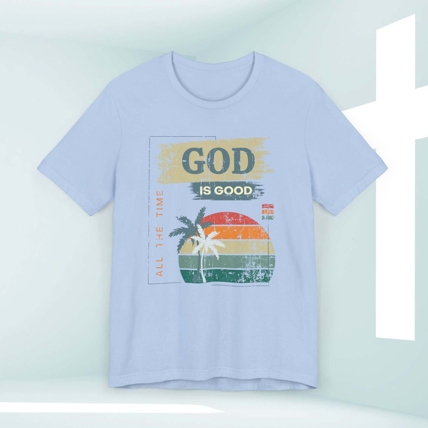 Light blue "God Is Good All The Time" Christian t-shirt for women with a sunset and palm tree design