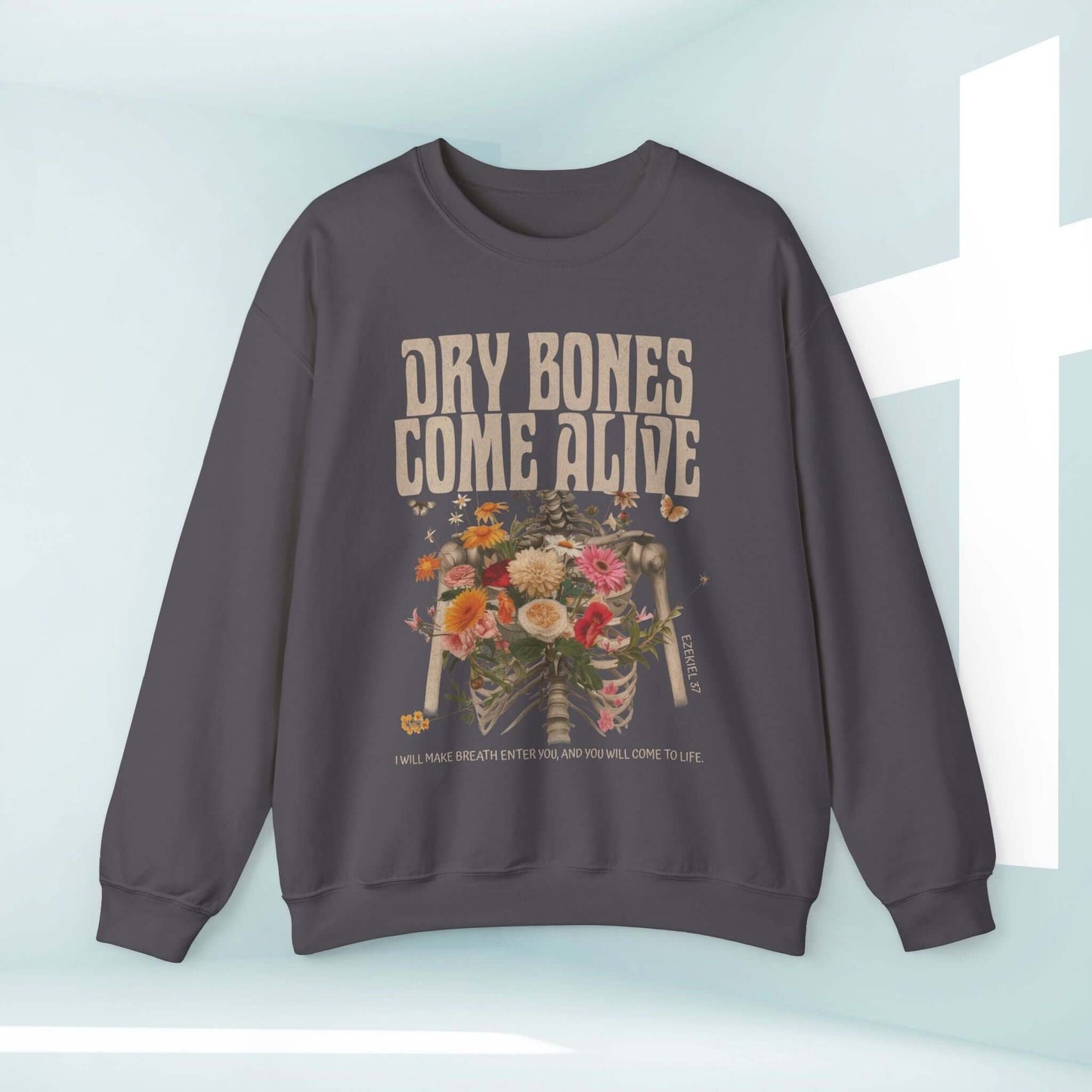 Christian Halloween sweatshirt with "Dry Bones Come Alive" design, featuring a skeleton and floral motif, inspiring biblical message.