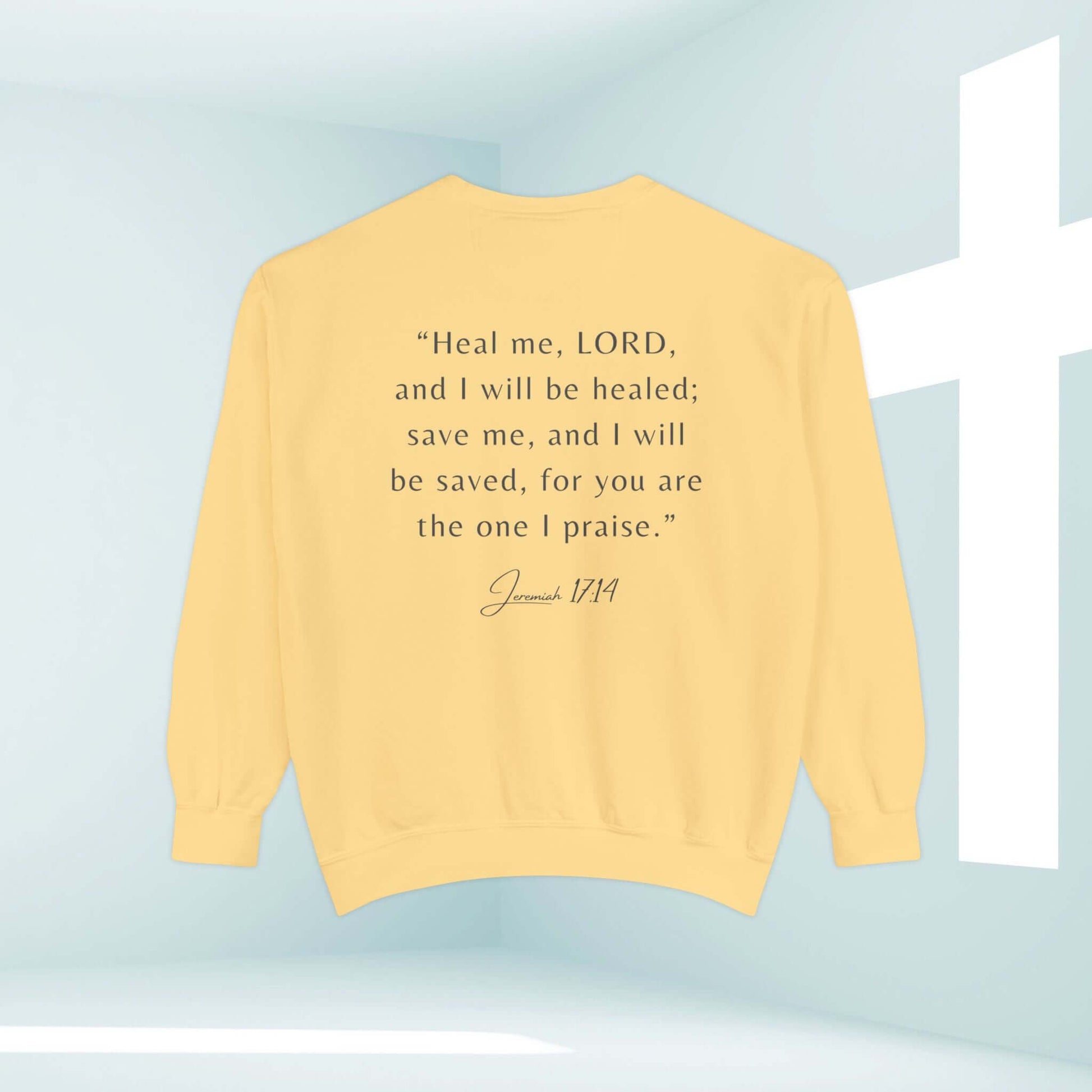 Yellow Hope In The Healing Christian sweatshirt with Jeremiah 17:14 bible verse in a minimalist design with a cross background.