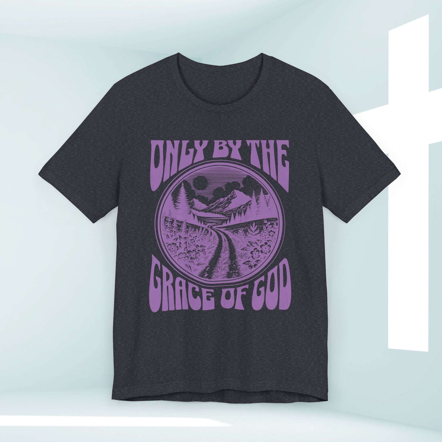 Only By The Grace Of God Christian T-shirt with Inspirational Message on a black tee displayed against a light background with a cross.