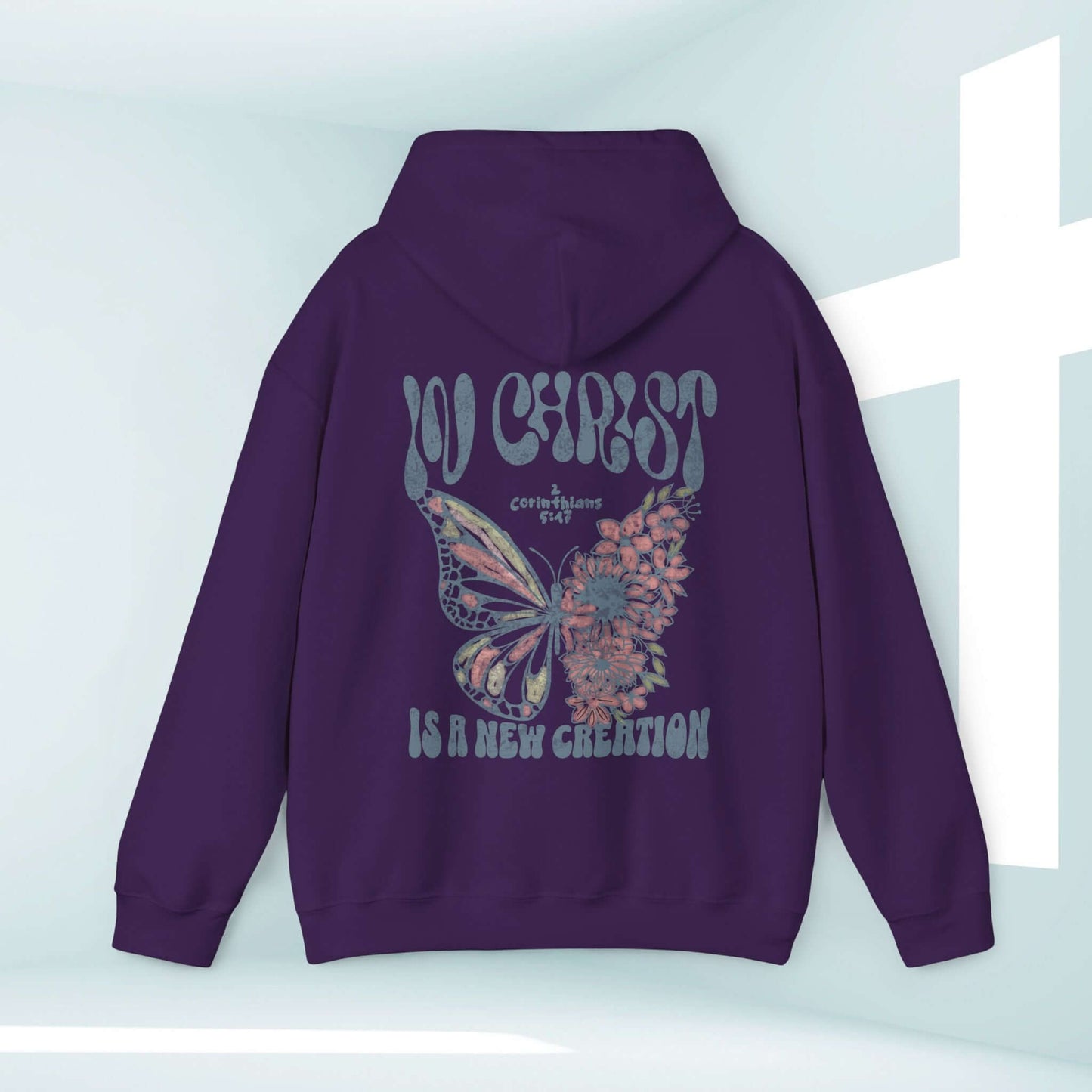 Faith-based "In Christ Is A New Creation" Christian hoodie with butterfly design, child of God message, inspirational Bible verse, and elevated faith.