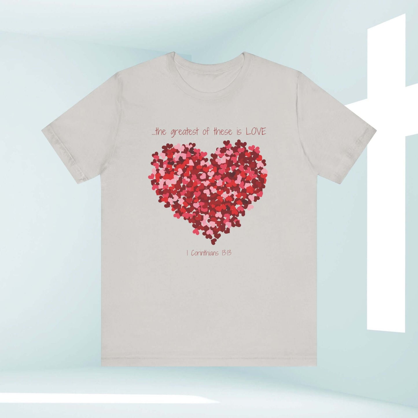 Christian Valentine's Day t-shirt with heart design and "The Greatest of These is Love" text, perfect as a wedding or anniversary gift.