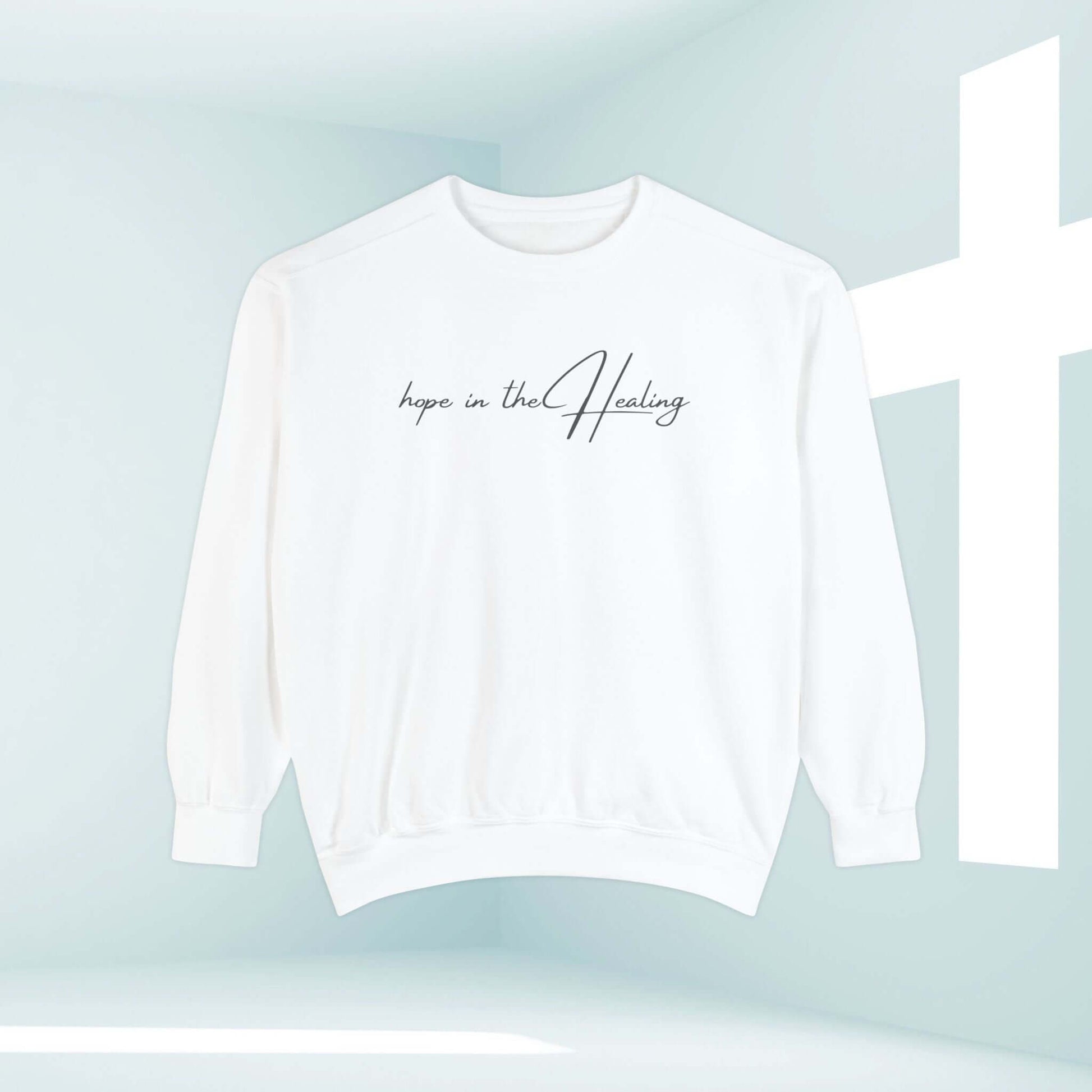 "Hope In The Healing Christian sweatshirt in white with minimalist design, perfect get well soon gift for cancer survivors and inspirational wear."