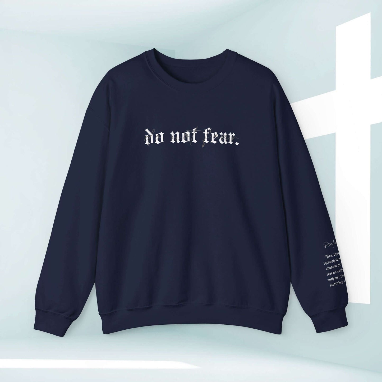 Christian "Do Not Fear" sweatshirt with inspiring message against light backdrop and cross, perfect faith-based apparel for uplifting.