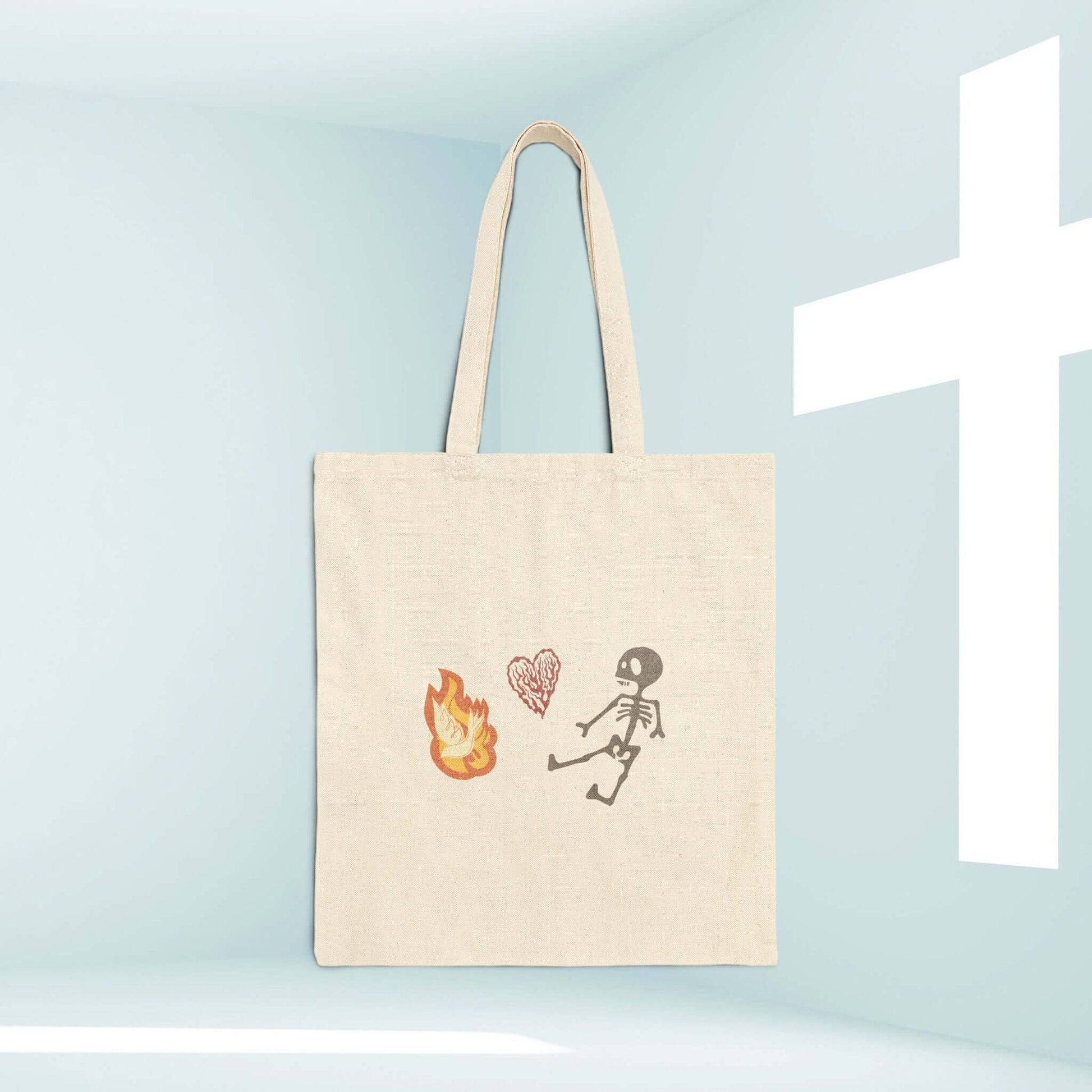 Christian Halloween tote bag with cute skeleton and flames design, perfect for trick or treat, scripture-inspired faith gift.