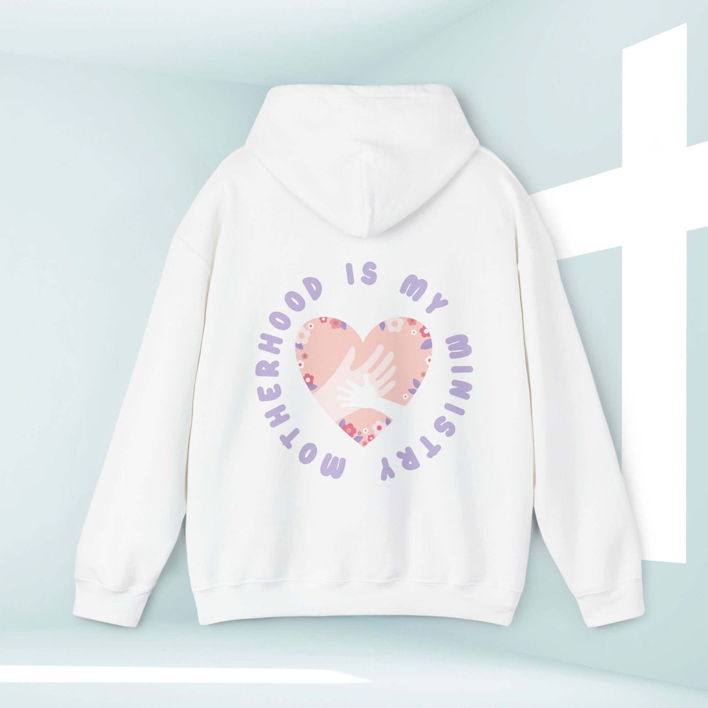 Motherhood Is My Ministry Christian hoodie, inspirational gift for new moms and homeschooling, white with heart design and bible verse.